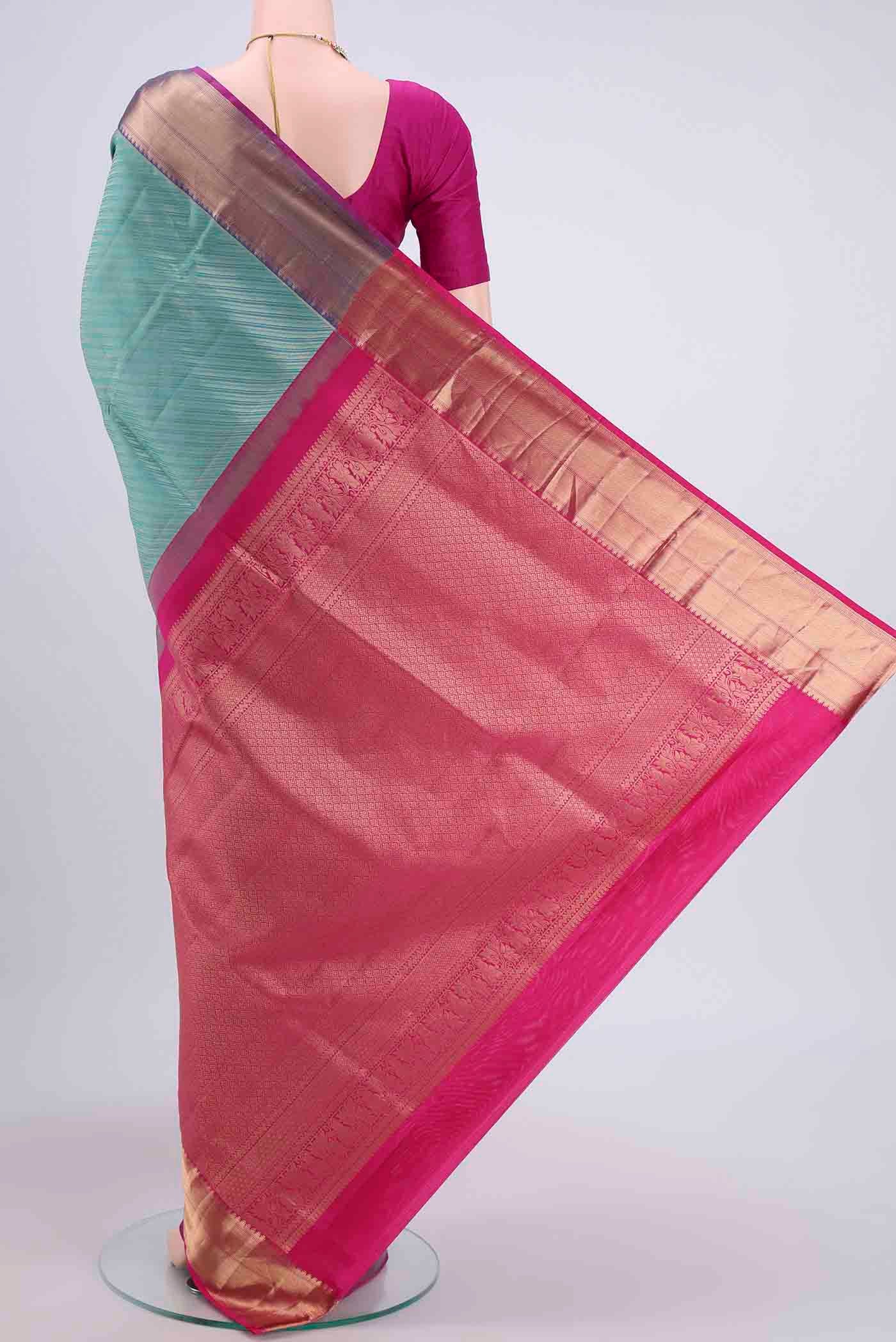Flat view of Turquoise Soft Silk Saree with Zari Brocade on the body and Zari Border
