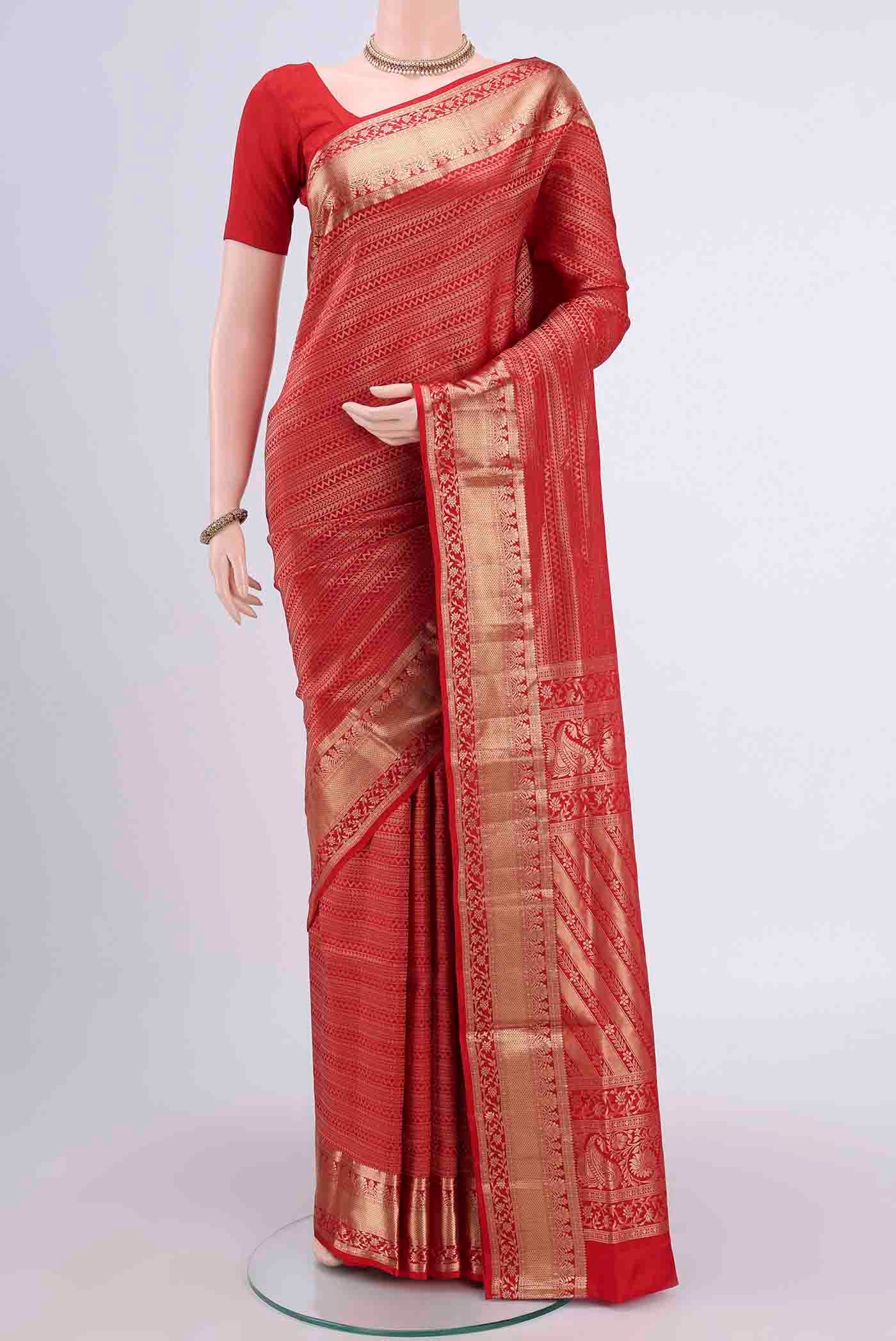 Red Soft Silk Saree with Zari Brocade on the body and Zari Border displayed on a mannequin