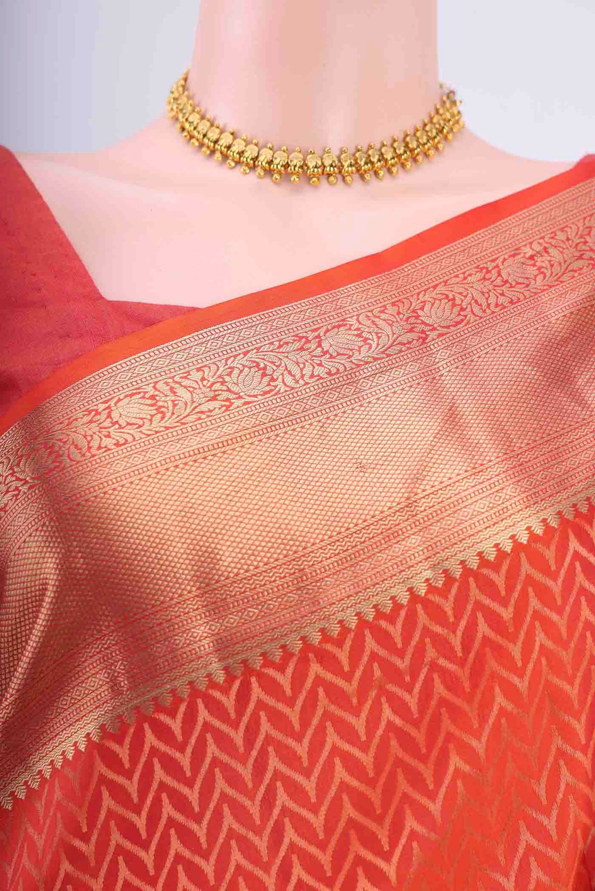 Border image of Brick Orange Soft Silk Saree with Jacquard With Zari Butta on the body and Zari Border