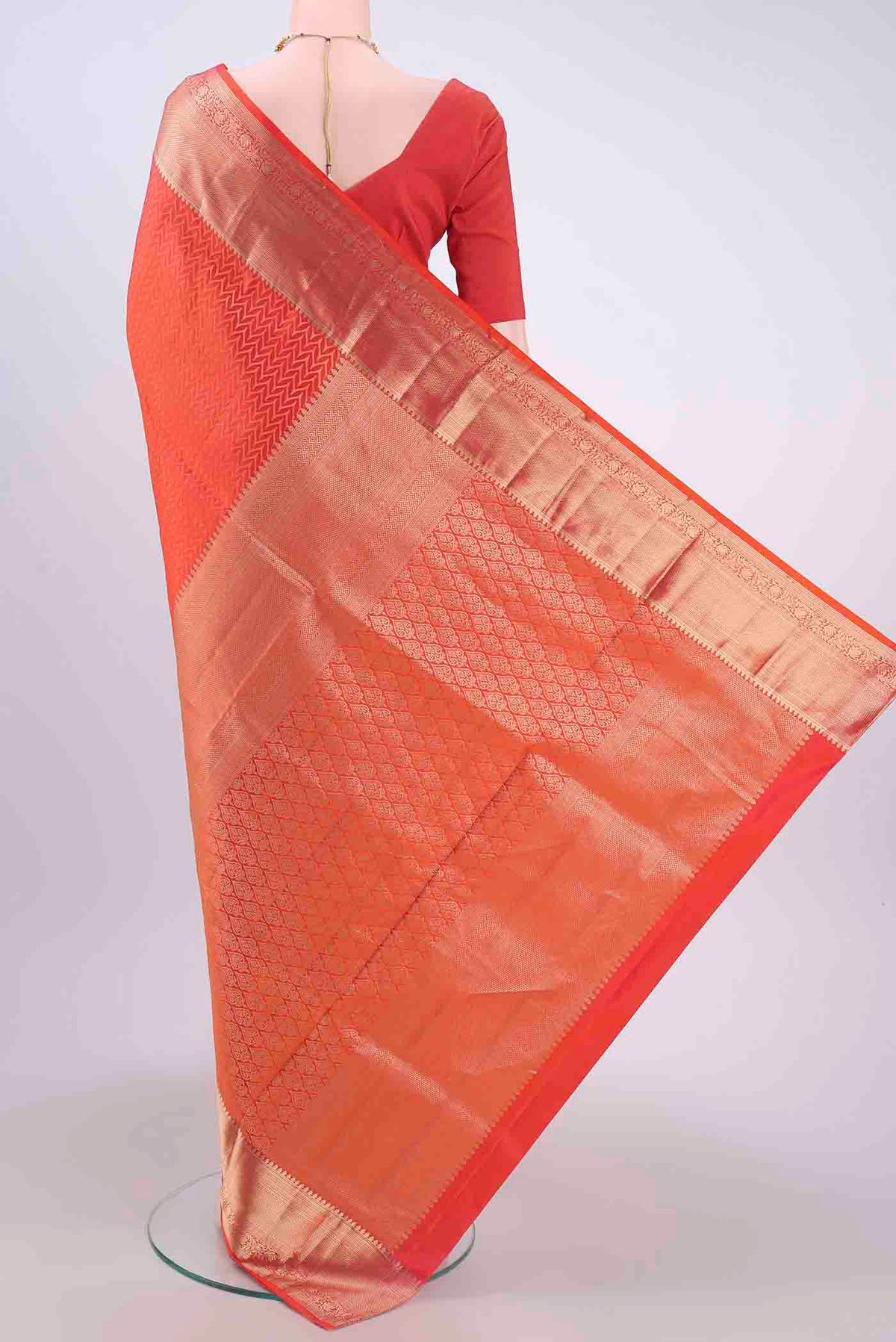 Flat view of Brick Orange Soft Silk Saree with Jacquard With Zari Butta on the body and Zari Border