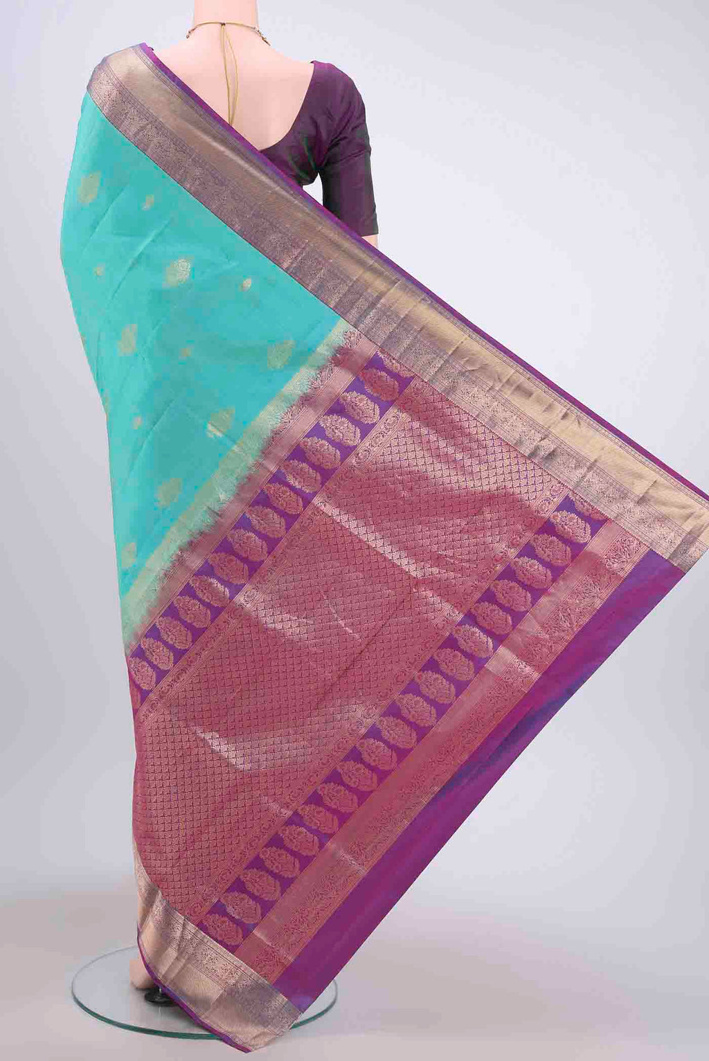 Flat view of Light Blue Soft Silk Saree with Zari Butta on the body and Zari Border