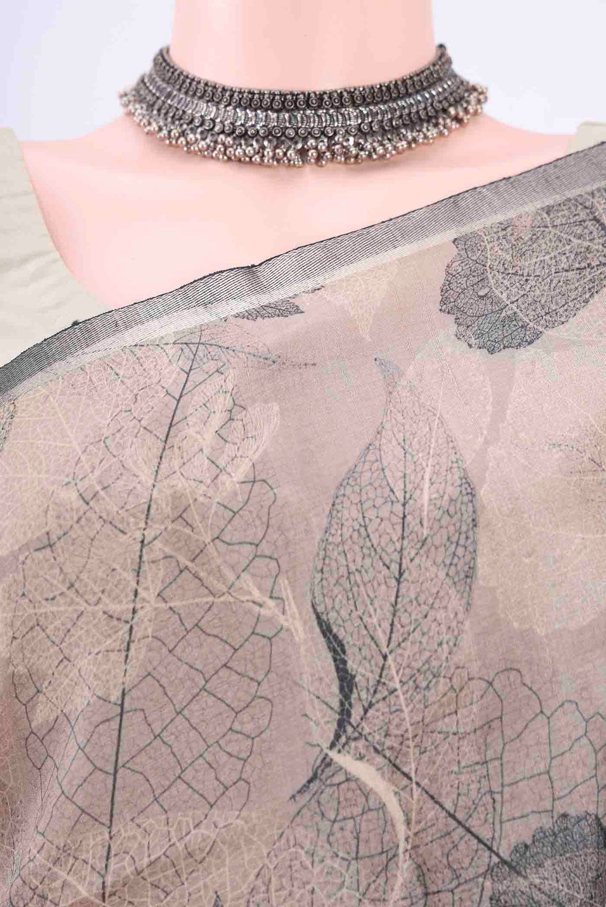 Border image of Black Dual Tone Tussar Silk Saree with Floral Print on the body and Zari Border