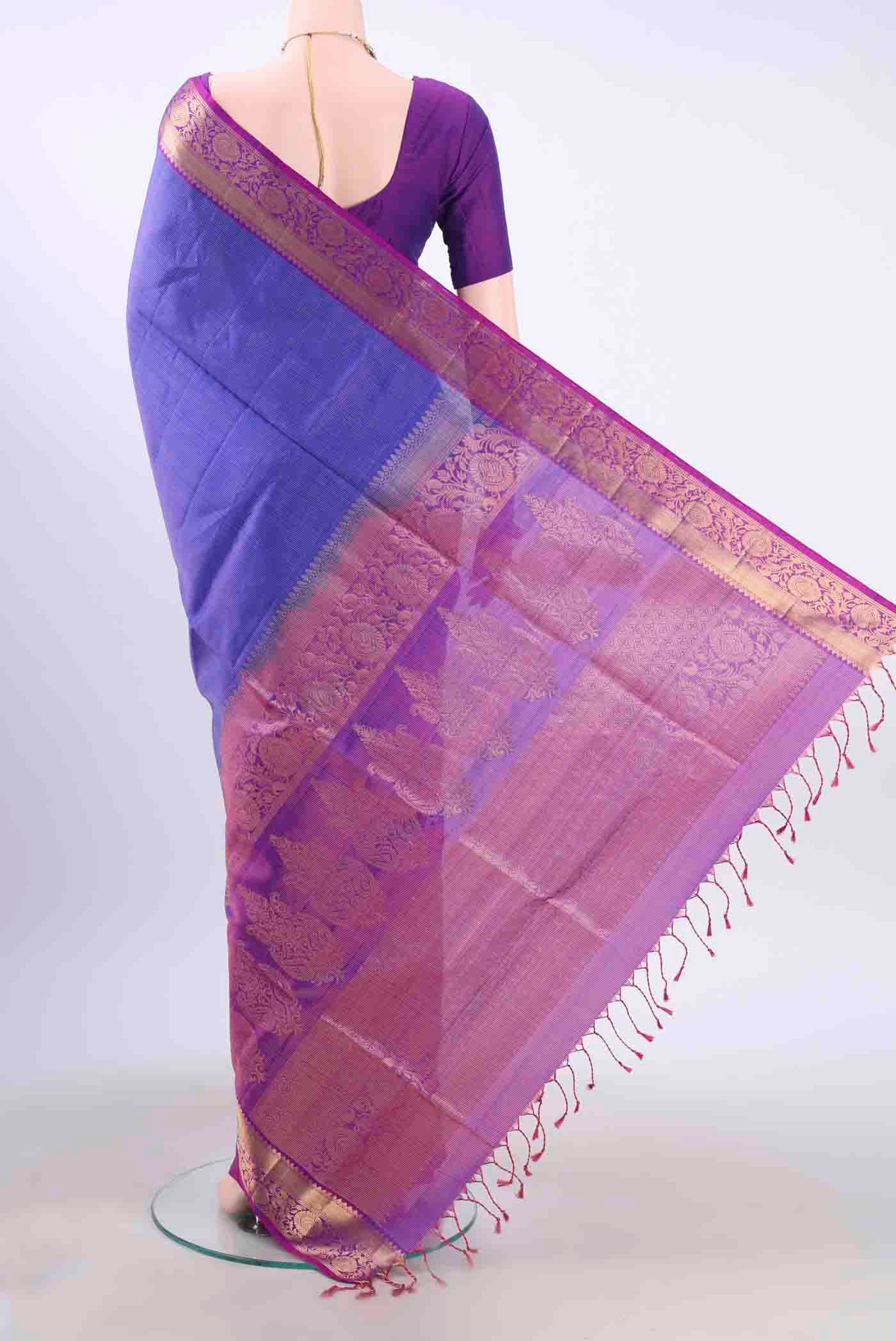 Flat view of Purple Soft Silk Saree with Zari Brocade on the body and Zari Border
