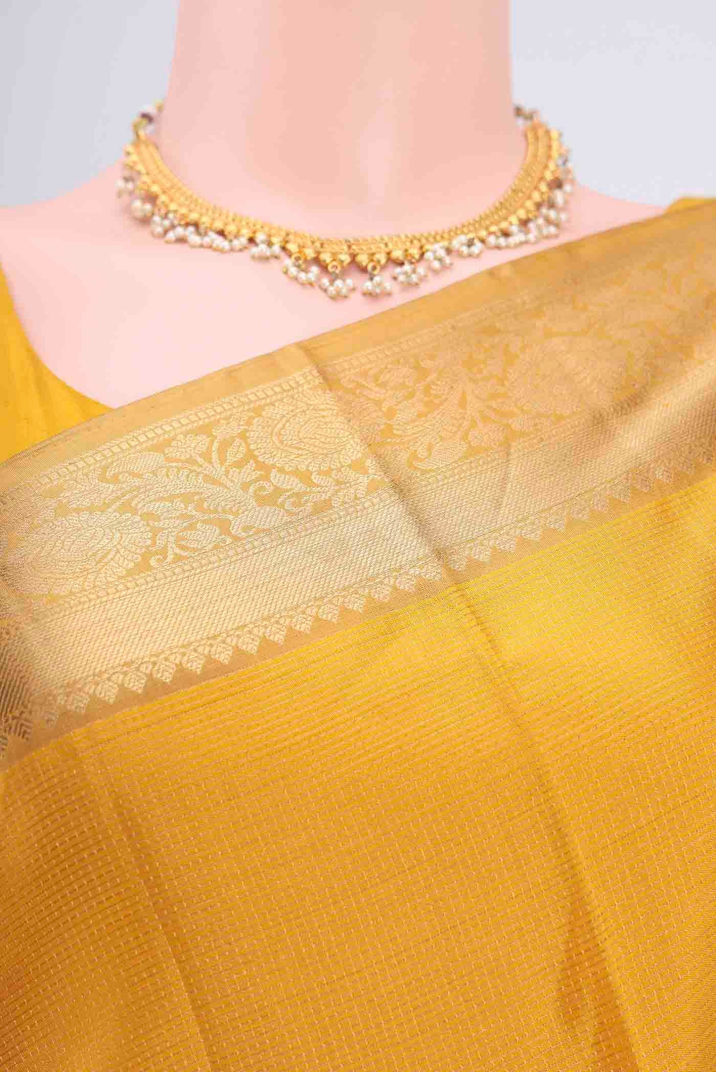 Border image of Yellow Soft Silk Saree with Checked design on the body and Zari Border