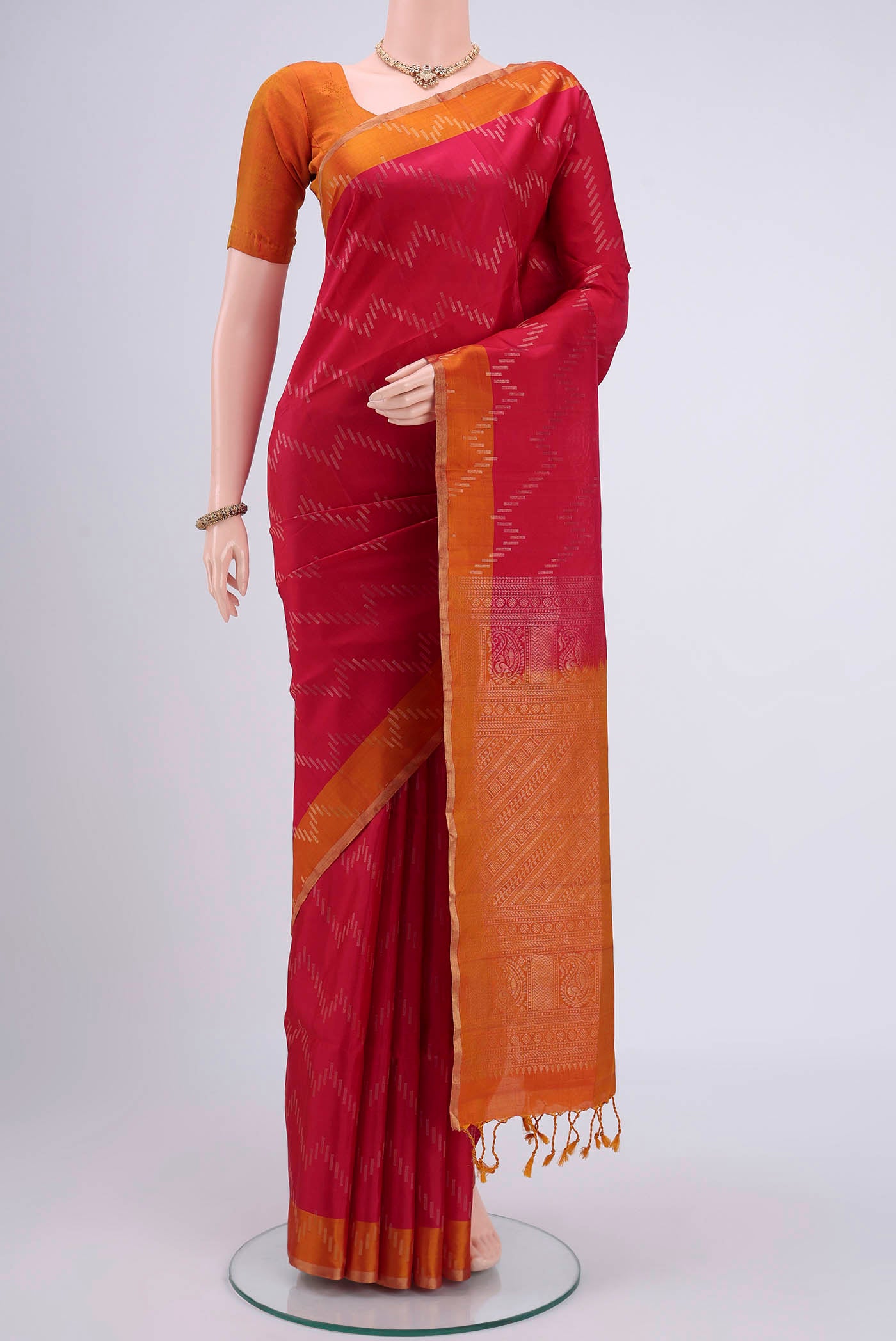 Maroon Dual Tone Soft Silk Saree with Zig Zag design on the body and Zari Border.  displayed on a mannequin