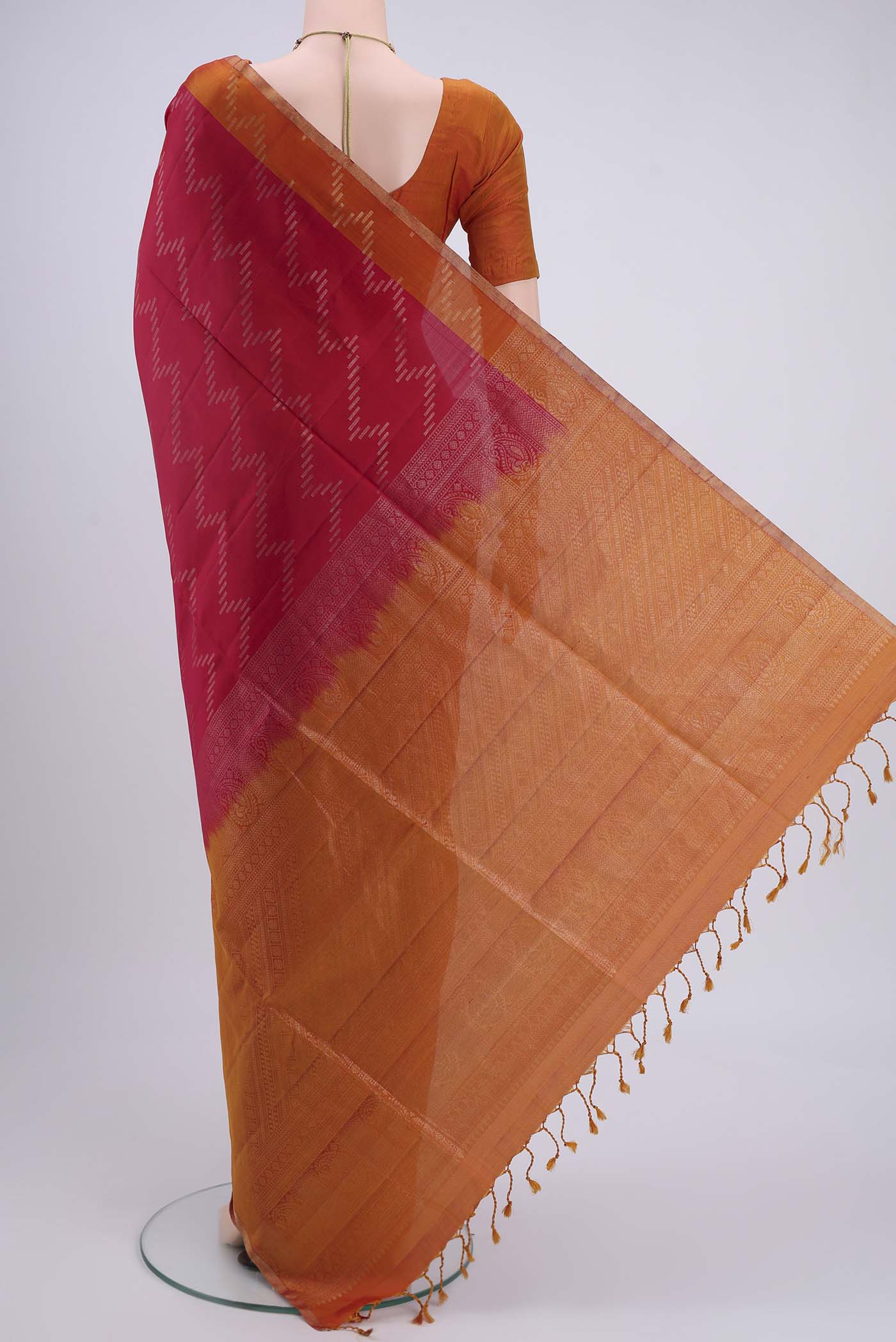 Flat view of Maroon Dual Tone Soft Silk Saree with Zig Zag design on the body and Zari Border. 