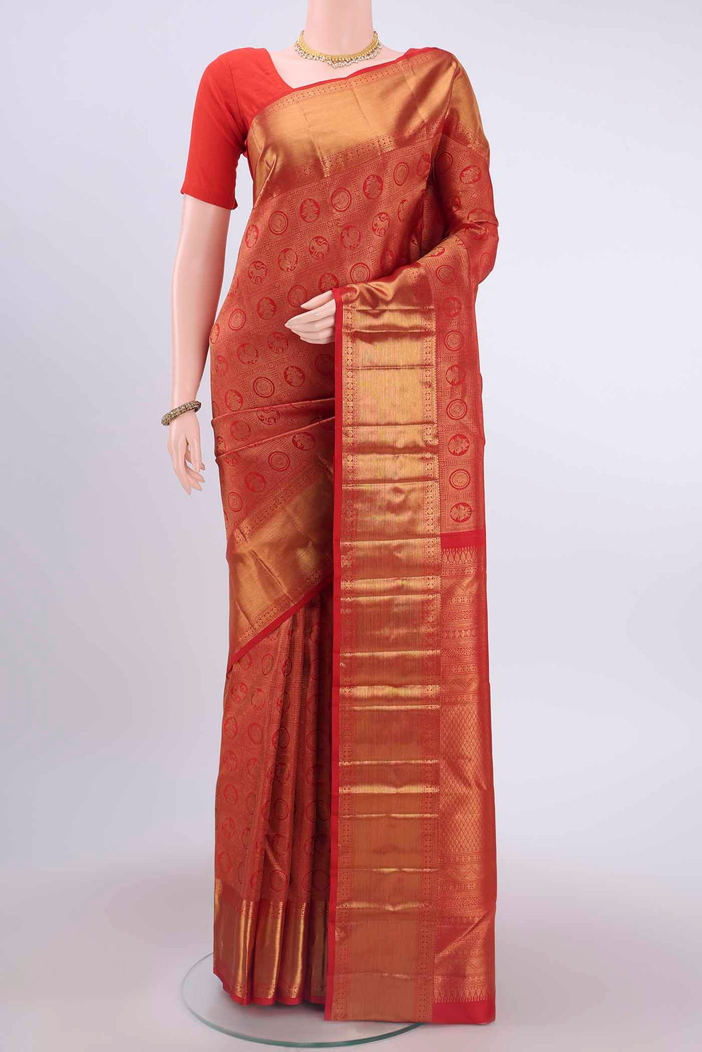 Imperial Red Kanchipuram Saree with Zari Brocade on the body and Zari Border displayed on a mannequin