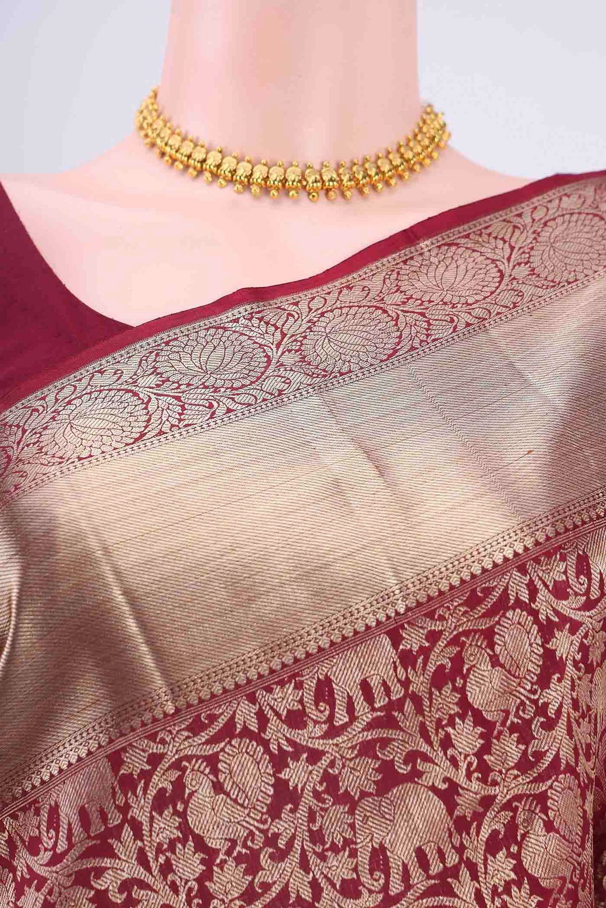Border image of Maroon Kanchipuram Saree with Zari Brocade on the body and Zari Border