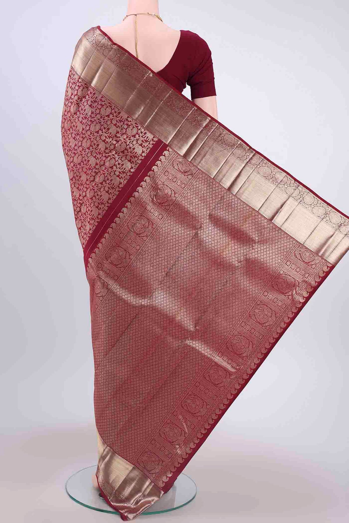 Flat view of Maroon Kanchipuram Saree with Zari Brocade on the body and Zari Border
