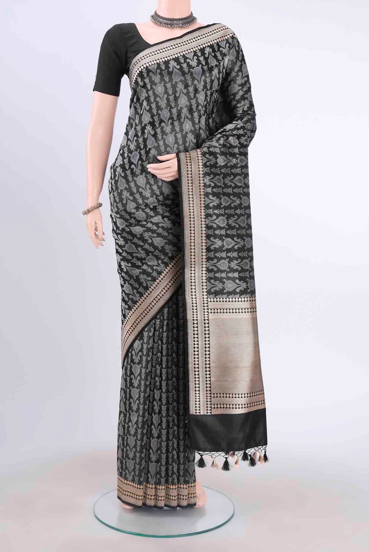 Black Dual Tone Banarasi Silk Saree with Thread Brocade on the body and Zari Border displayed on a mannequin