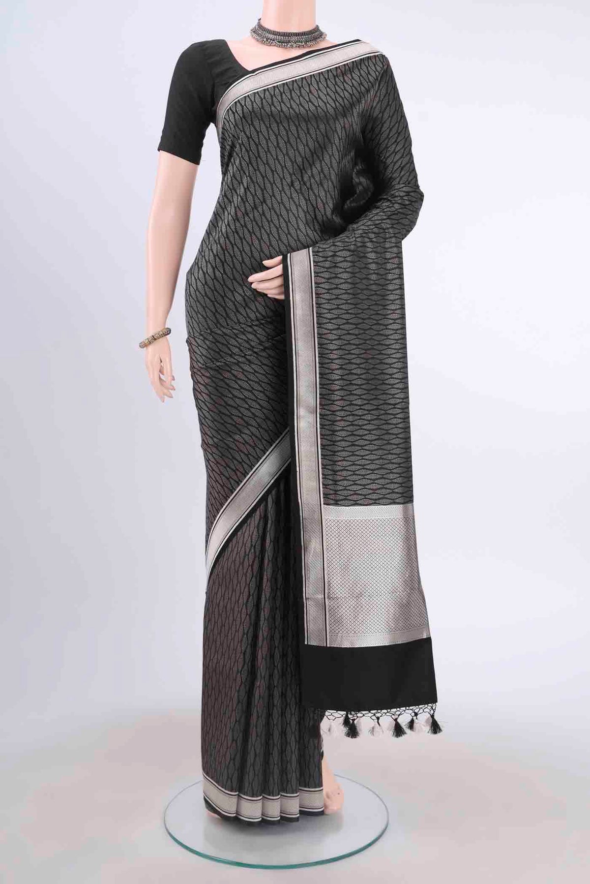Black Dual Tone Banarasi Silk Saree with Zari Brocade on the body and Zari Border displayed on a mannequin