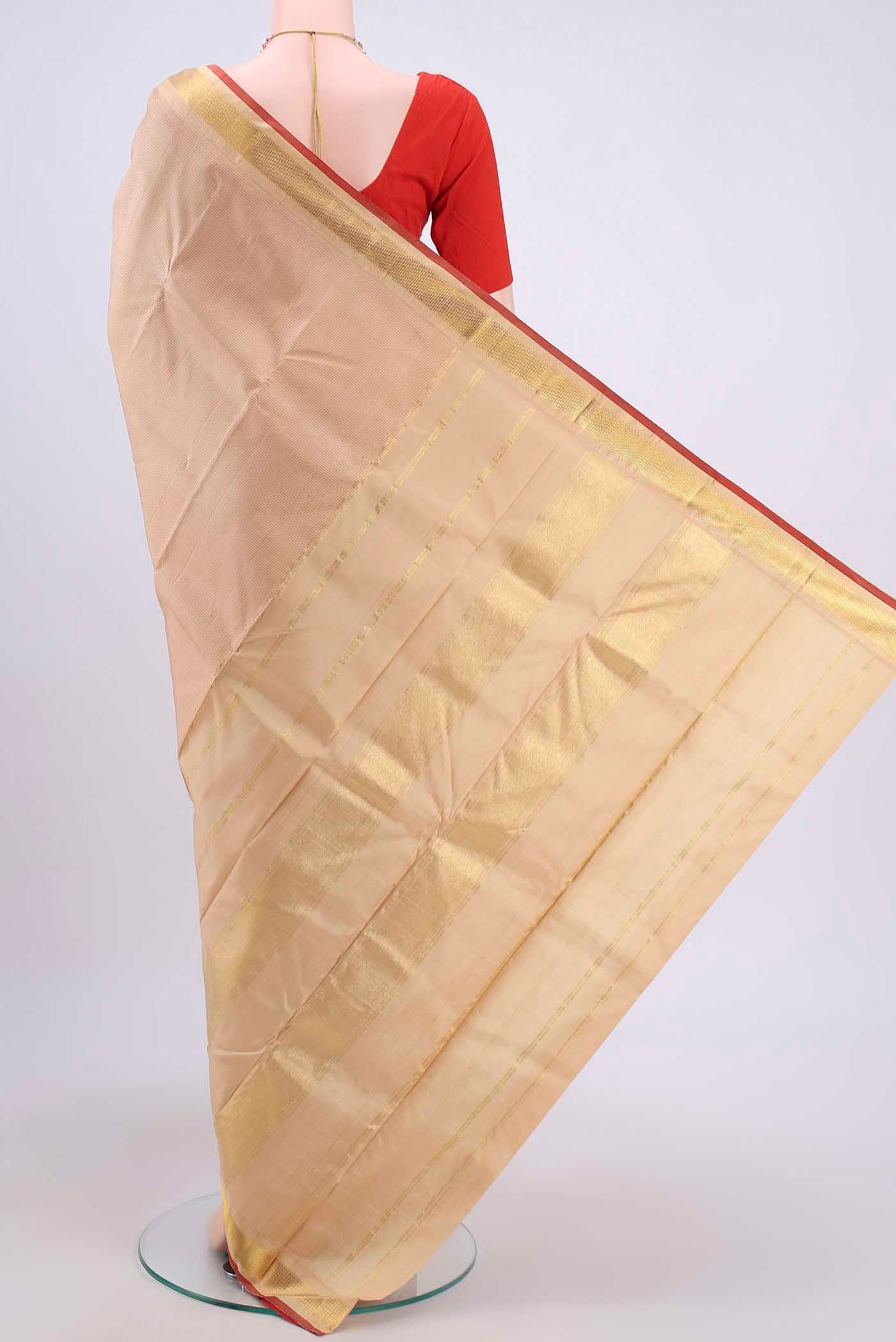 Flat view of Beige Kanchipuram Saree with Stripes on the body and Zari Border