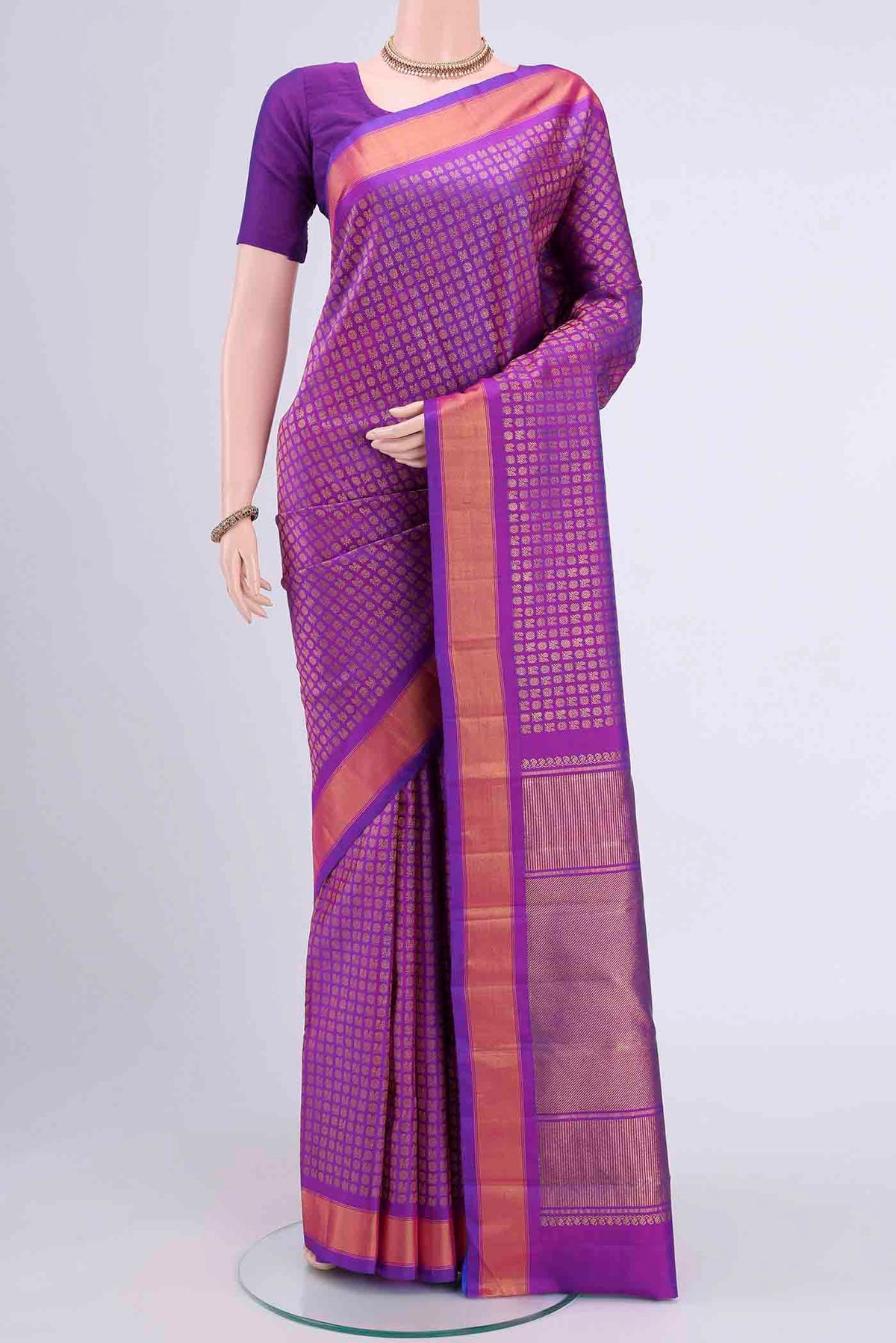 Pure Silk Pure Zari Magenta Kanchipuram Saree with Zari Brocade on the body and Zari Border displayed on a mannequin