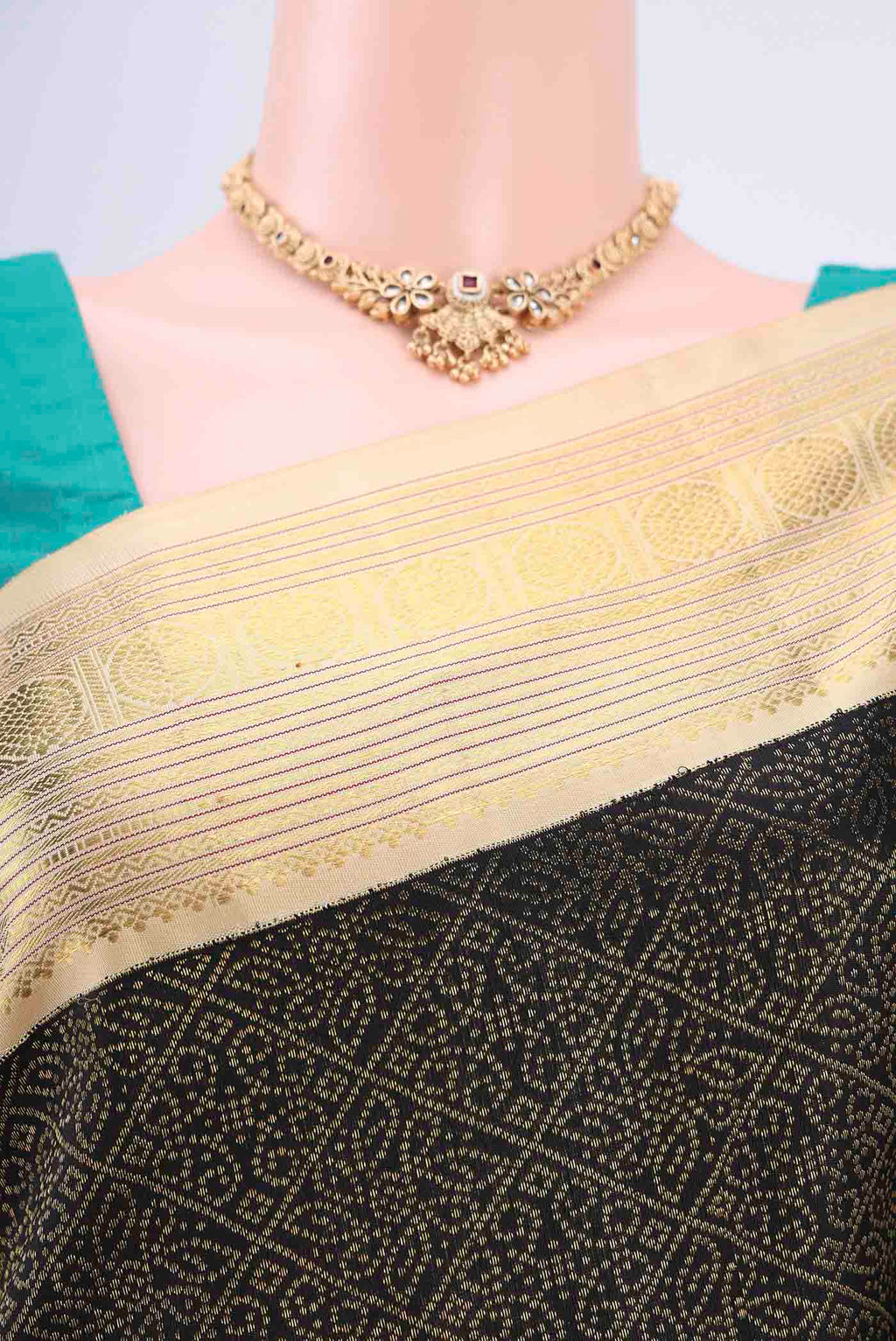 Border image of Black Kanjivaram Silk Saree with Plain Body and Ganga Jamuna Border. 