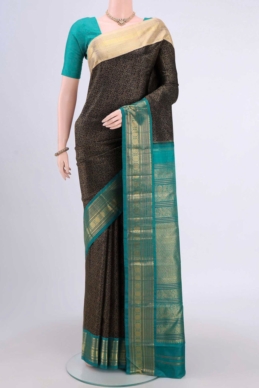 Black Kanjivaram Silk Saree with Plain Body and Ganga Jamuna Border.  displayed on a mannequin