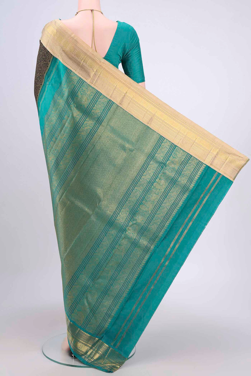 Flat view of Black Kanjivaram Silk Saree with Plain Body and Ganga Jamuna Border. 