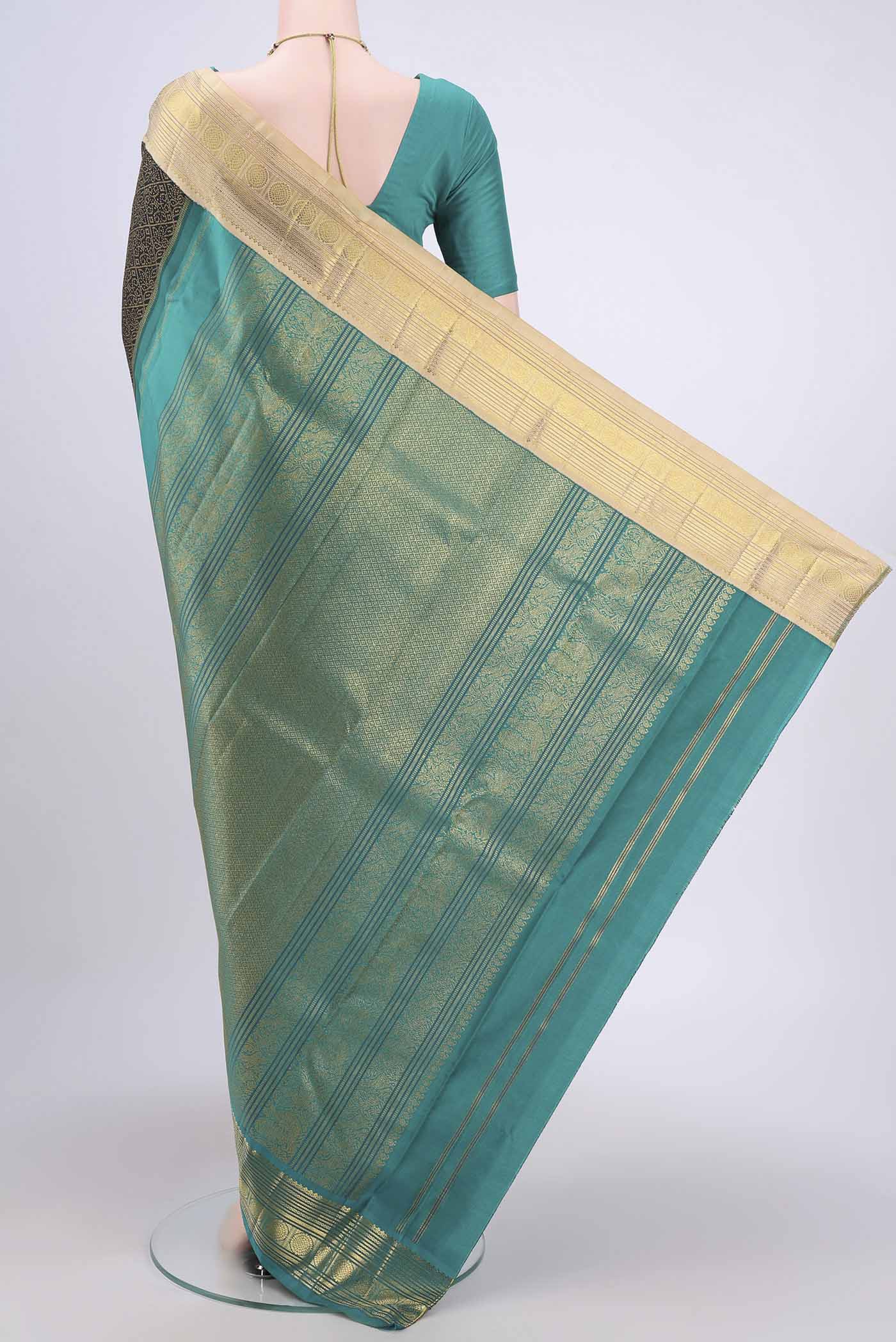 Flat view of Black Kanjivaram Silk Saree with Plain Body and Ganga Jamuna Border. 