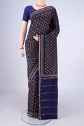 Navy Blue Printed Silk Saree with Printed design on the body and Zari Border.  displayed on a mannequin
