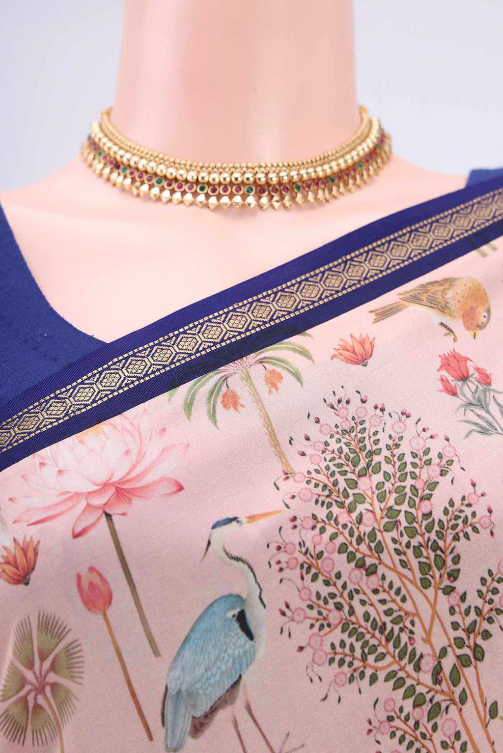 Border image of Peach Mysore Crepe Saree with Floral Print on the body and Zari Border. 