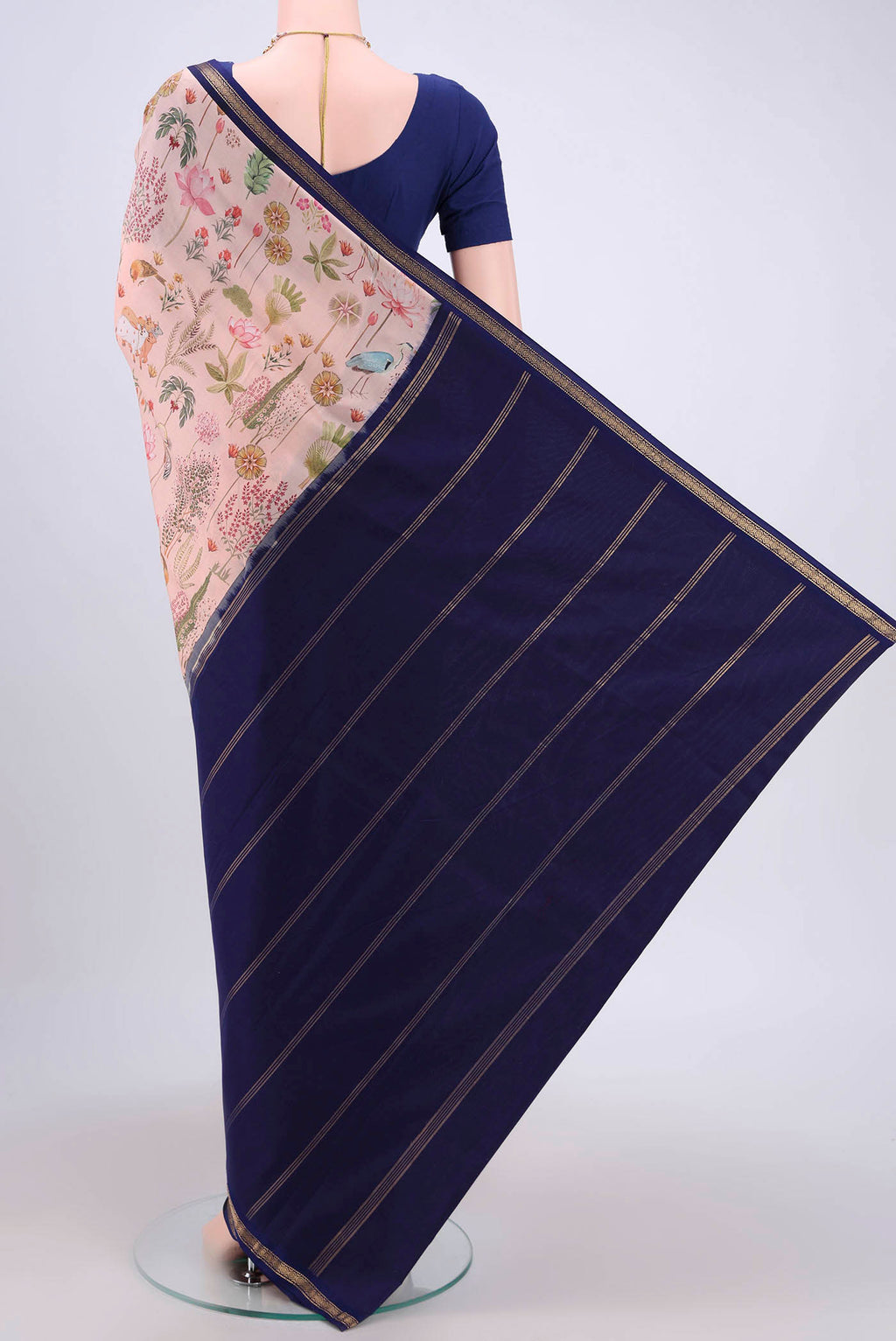 Flat view of Peach Mysore Crepe Saree with Floral Print on the body and Zari Border. 