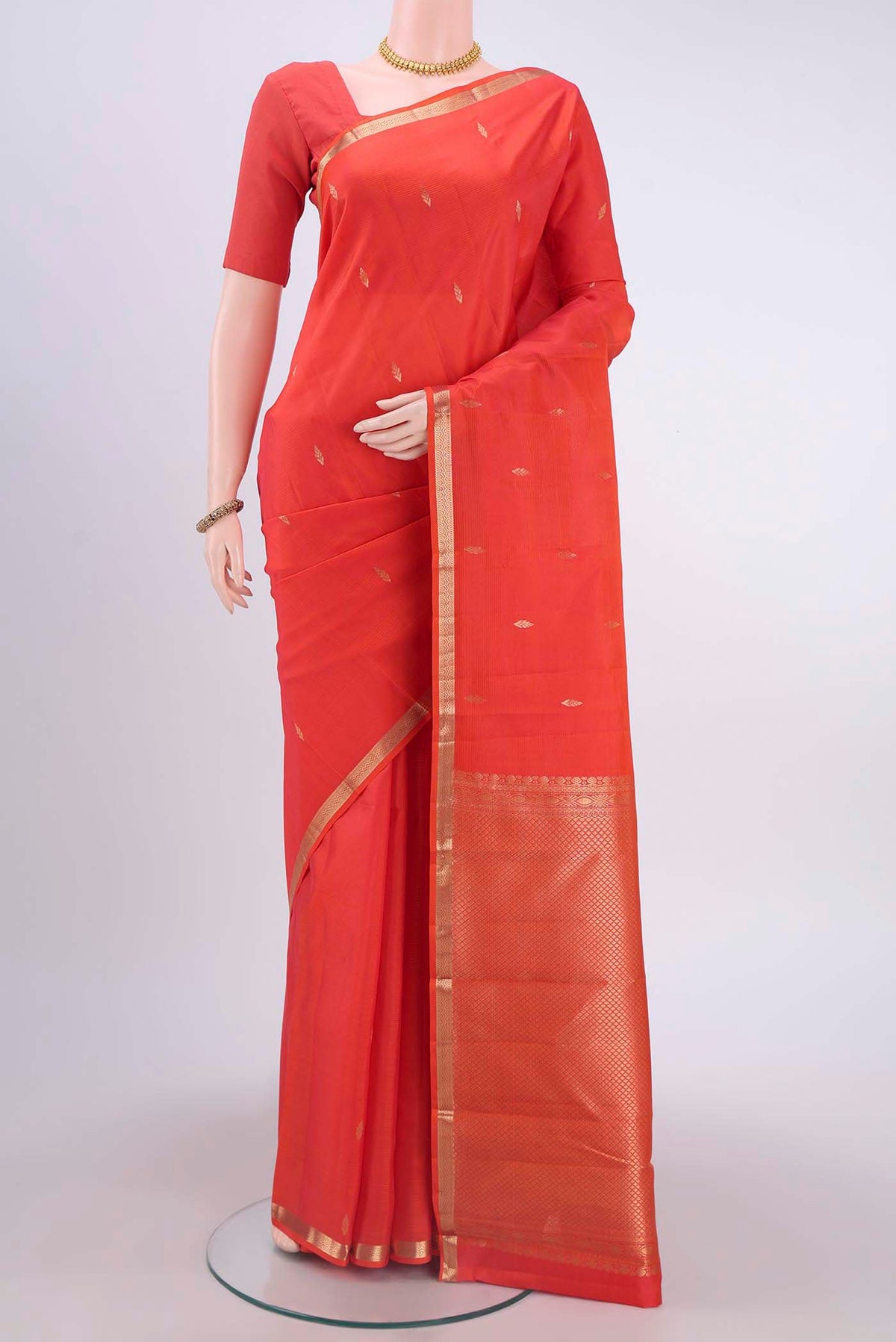 Orange Nangavalli Silk [ Salem ] Saree with Zari Butta on the body and Zari Border displayed on a mannequin