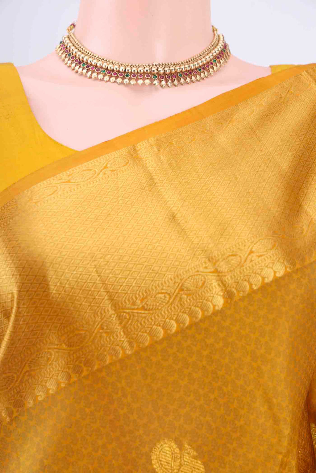 Border image of Pure Silk Pure Zari Mustard Kanchipuram Saree with Jacquard With Zari Butta on the body and Zari Border