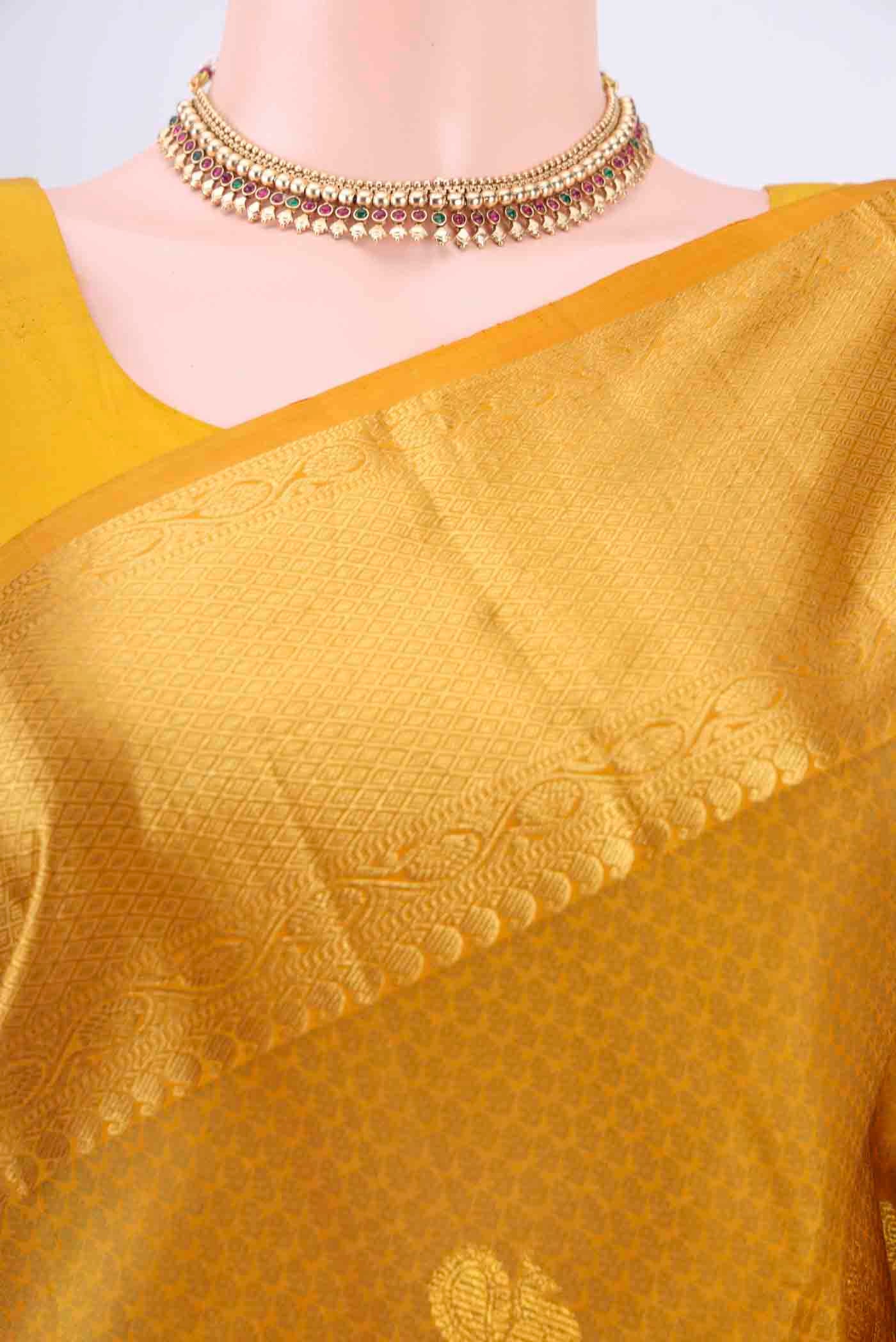 Border image of Pure Silk Pure Zari Mustard Kanchipuram Saree with Jacquard With Zari Butta on the body and Zari Border