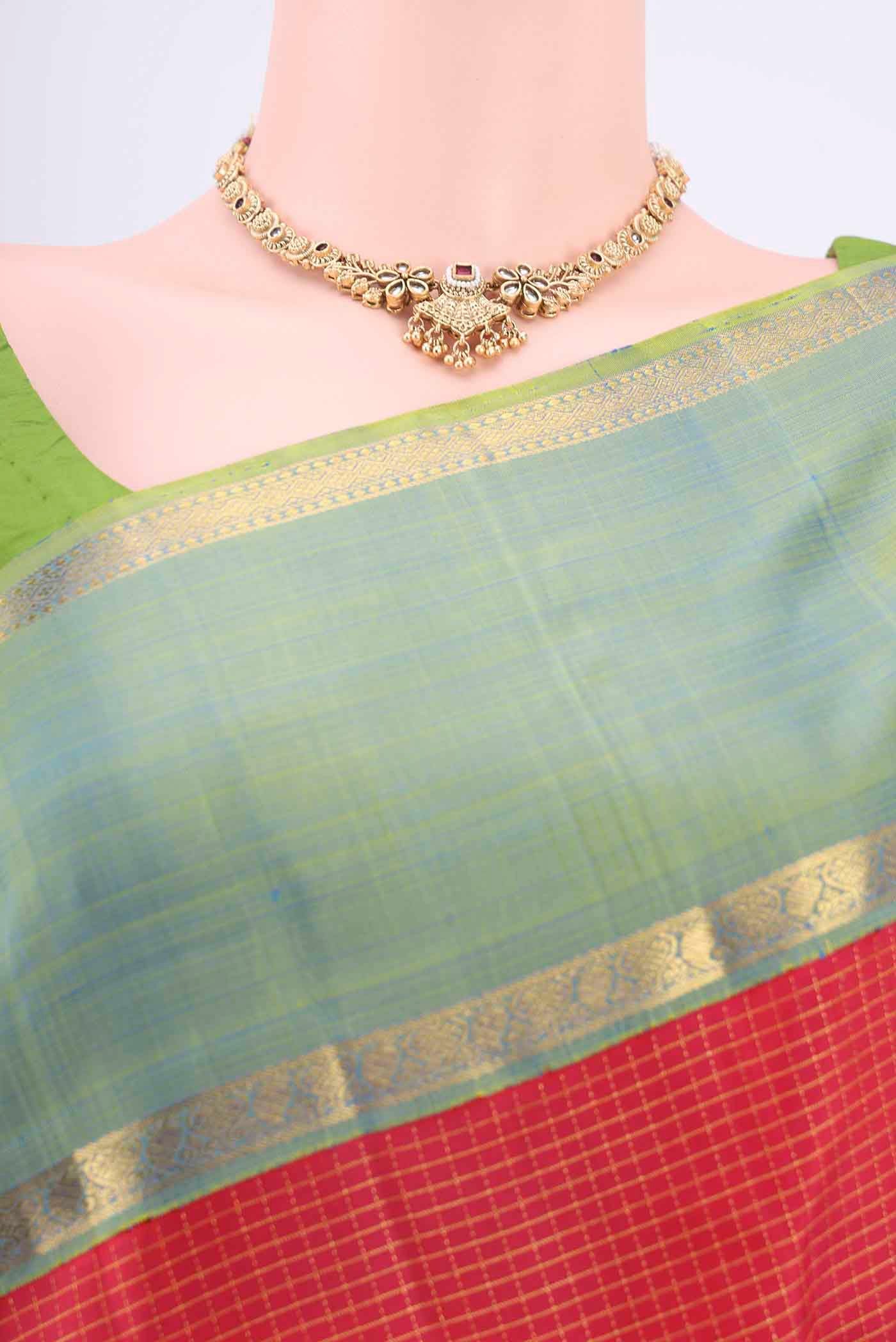 Border image of Red Kanchipuram Silk Saree with Checked design on the body and Zari Border