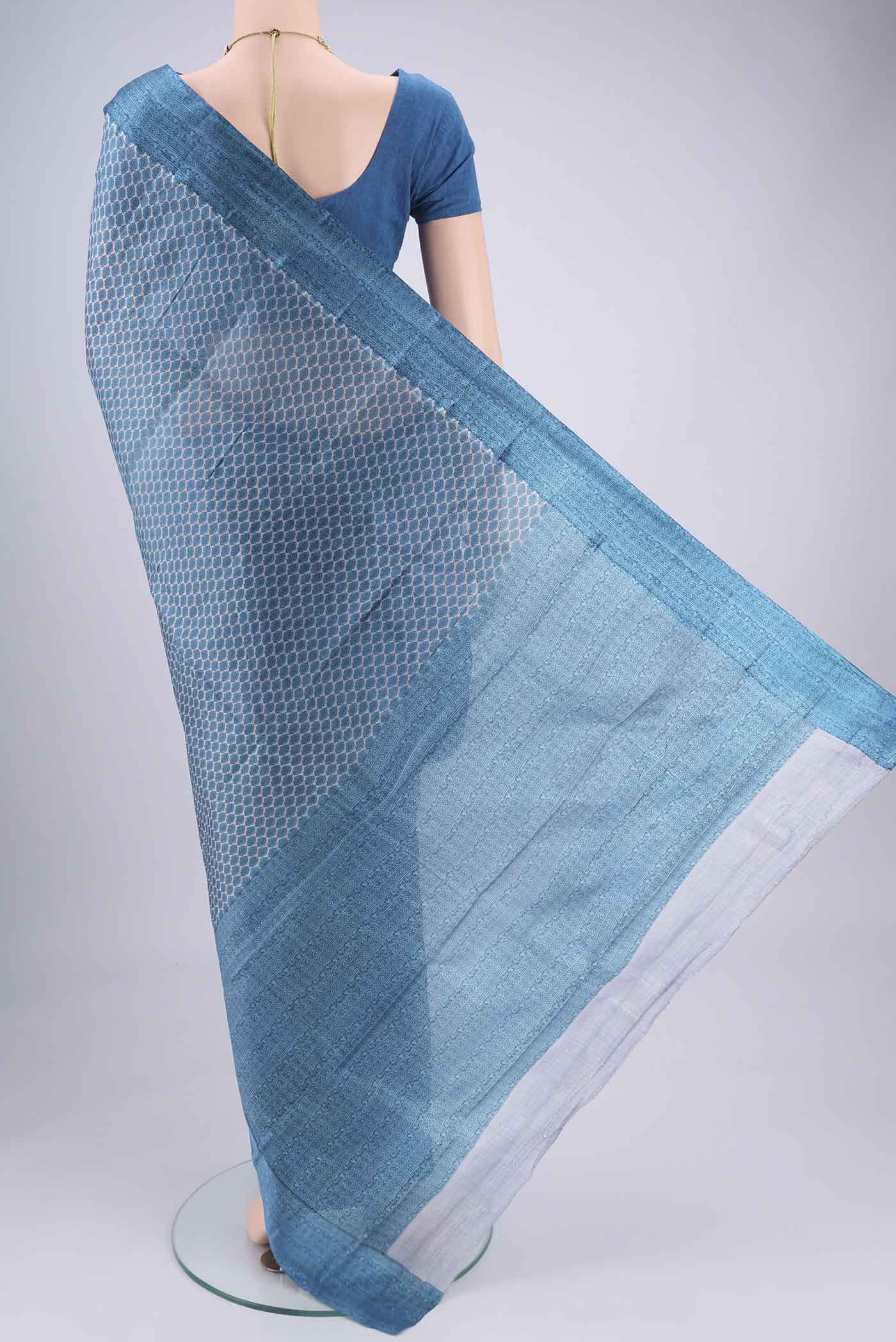Flat view of Blue Grey Printed Silk Saree with Floral Print on the body and Printed Border. 