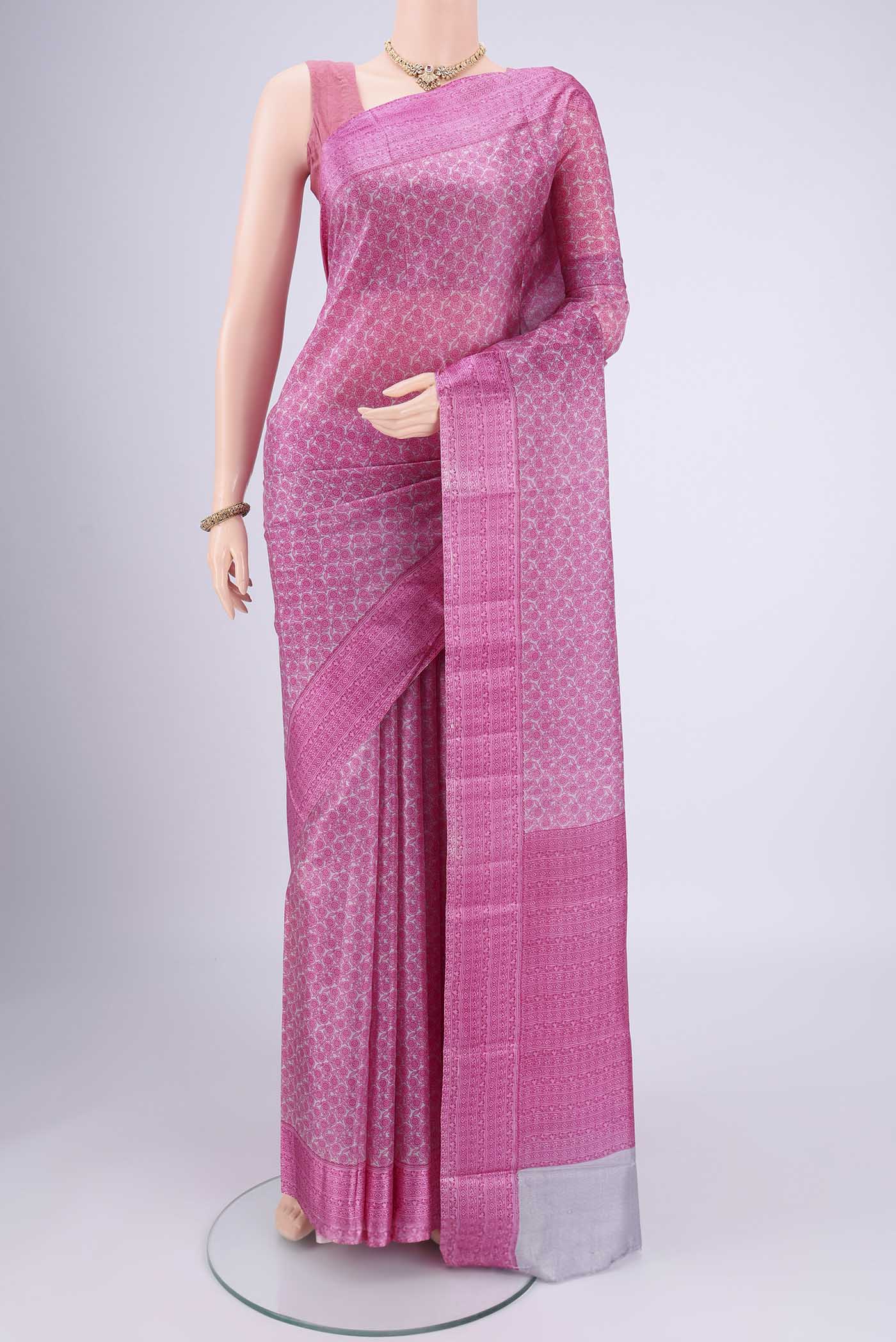 Grey Printed Silk Saree with Floral Print on the body and Printed Border.  displayed on a mannequin