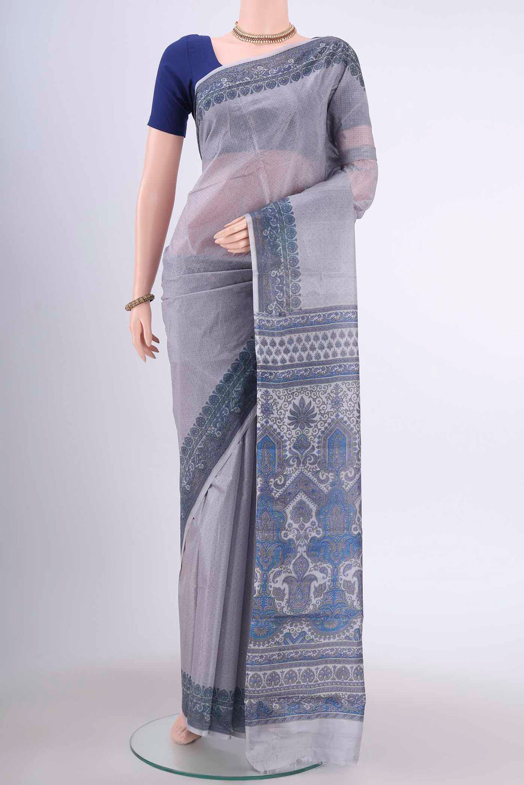 Mauve Printed Silk Saree with Floral Print on the body and Printed Border displayed on a mannequin