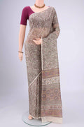 Off White Printed Silk Saree with Floral Print on the body and Printed Border.  displayed on a mannequin
