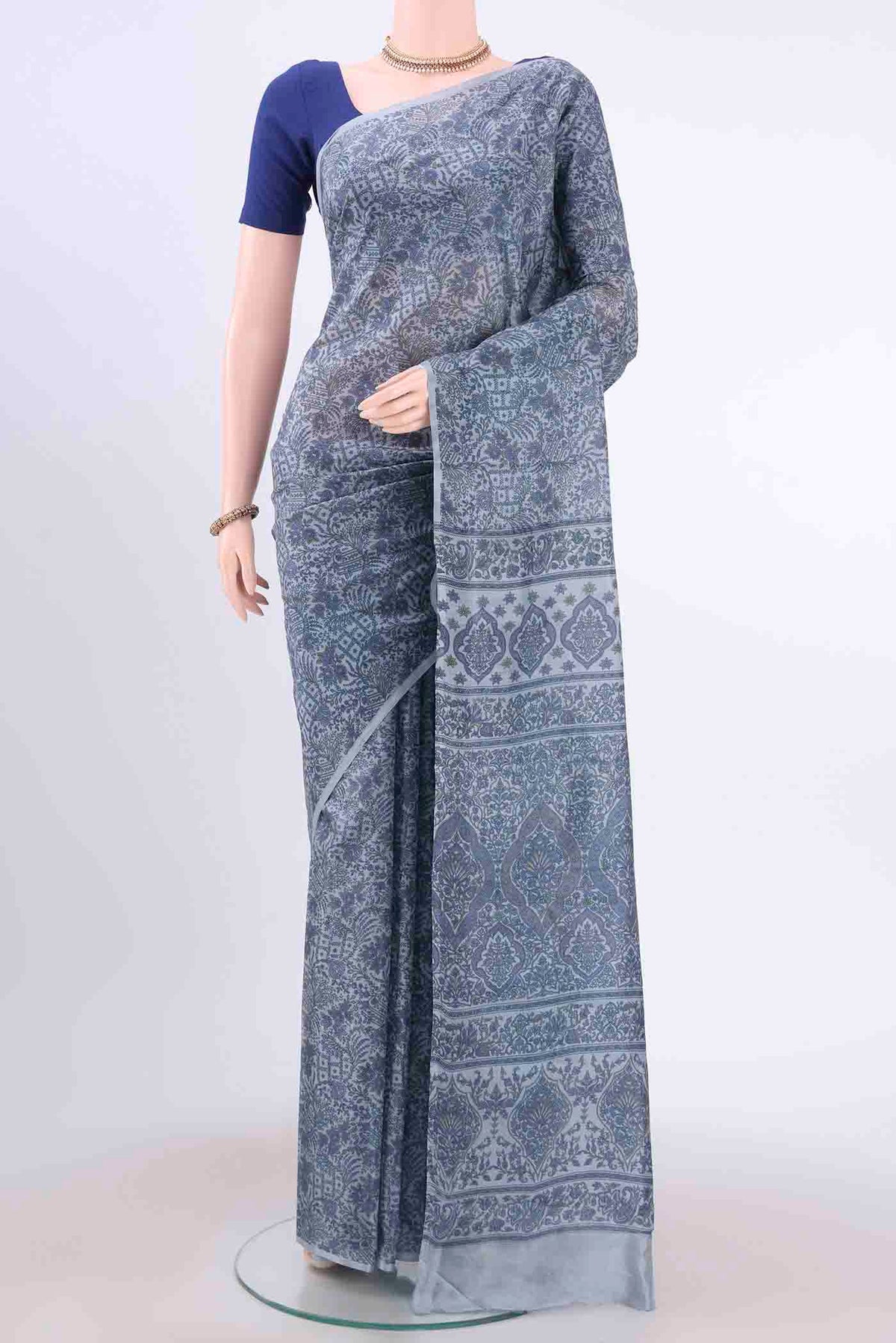 Blue Grey Printed Silk Saree with Floral Print on the body and Printed Border displayed on a mannequin