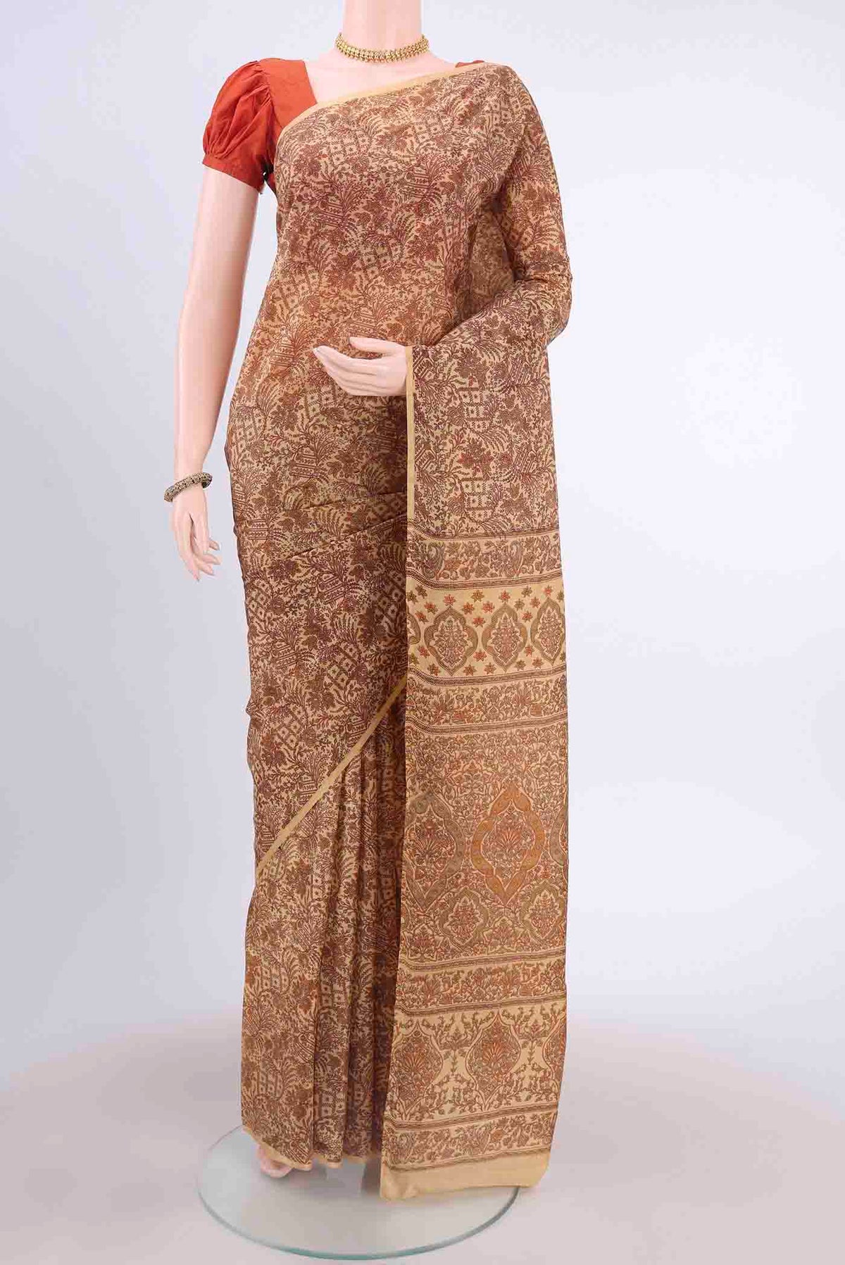 Beige Printed Silk Saree with Floral Print on the body and Plain Border displayed on a mannequin