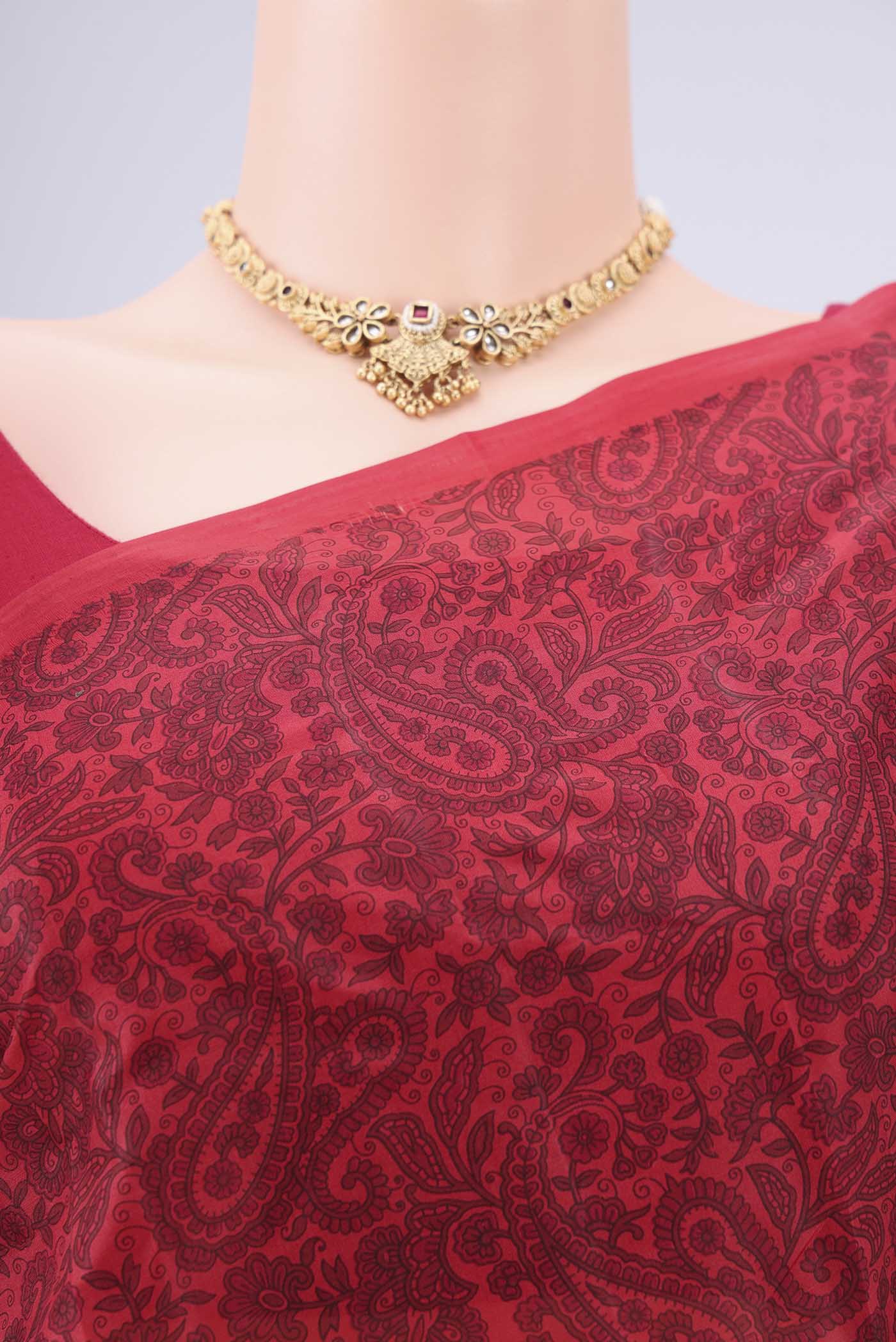 Border image of Red Printed Silk Saree with Floral Print on the body and Printed Border. 