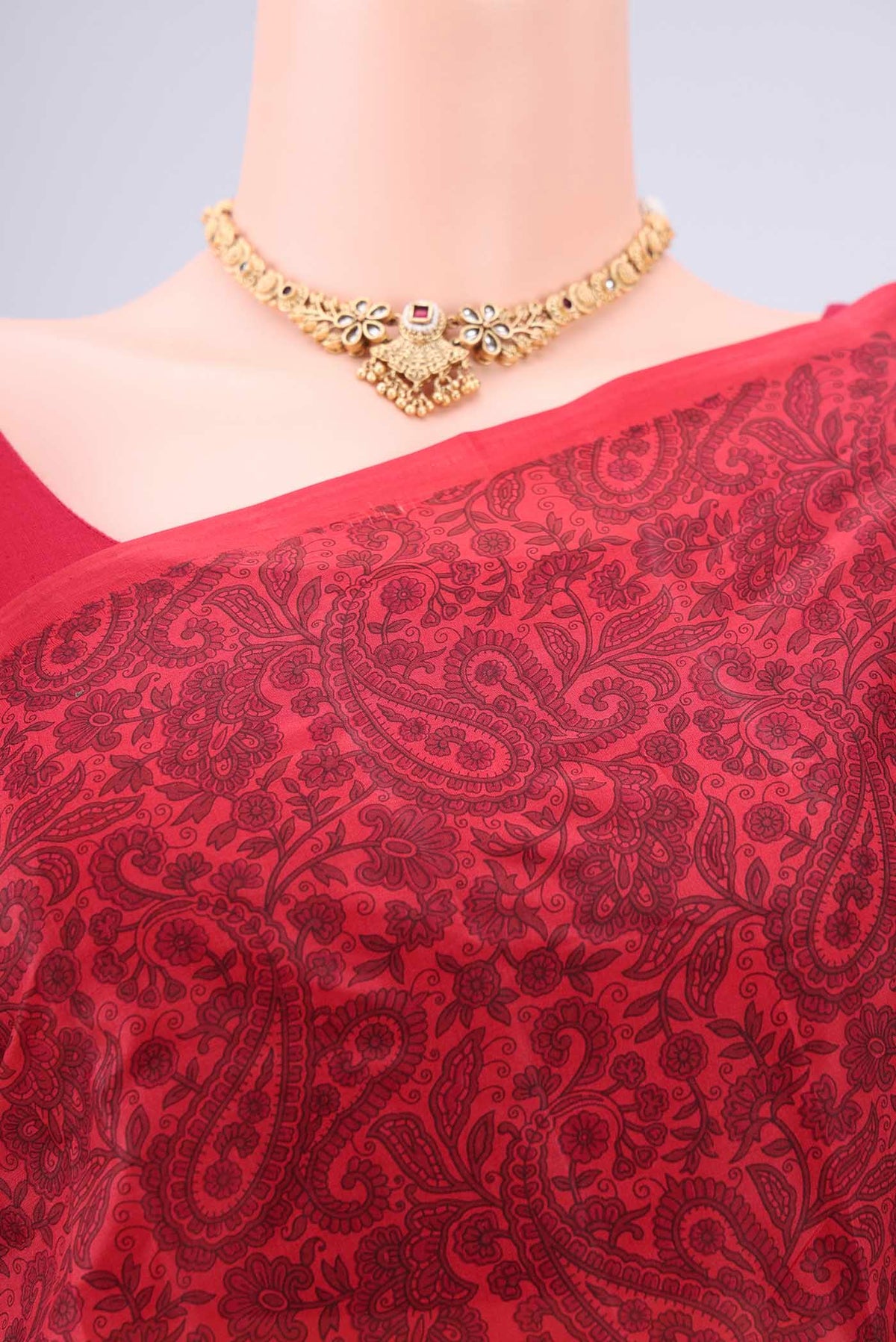 Border image of Red Printed Silk Saree with Floral Print on the body and Printed Border. 