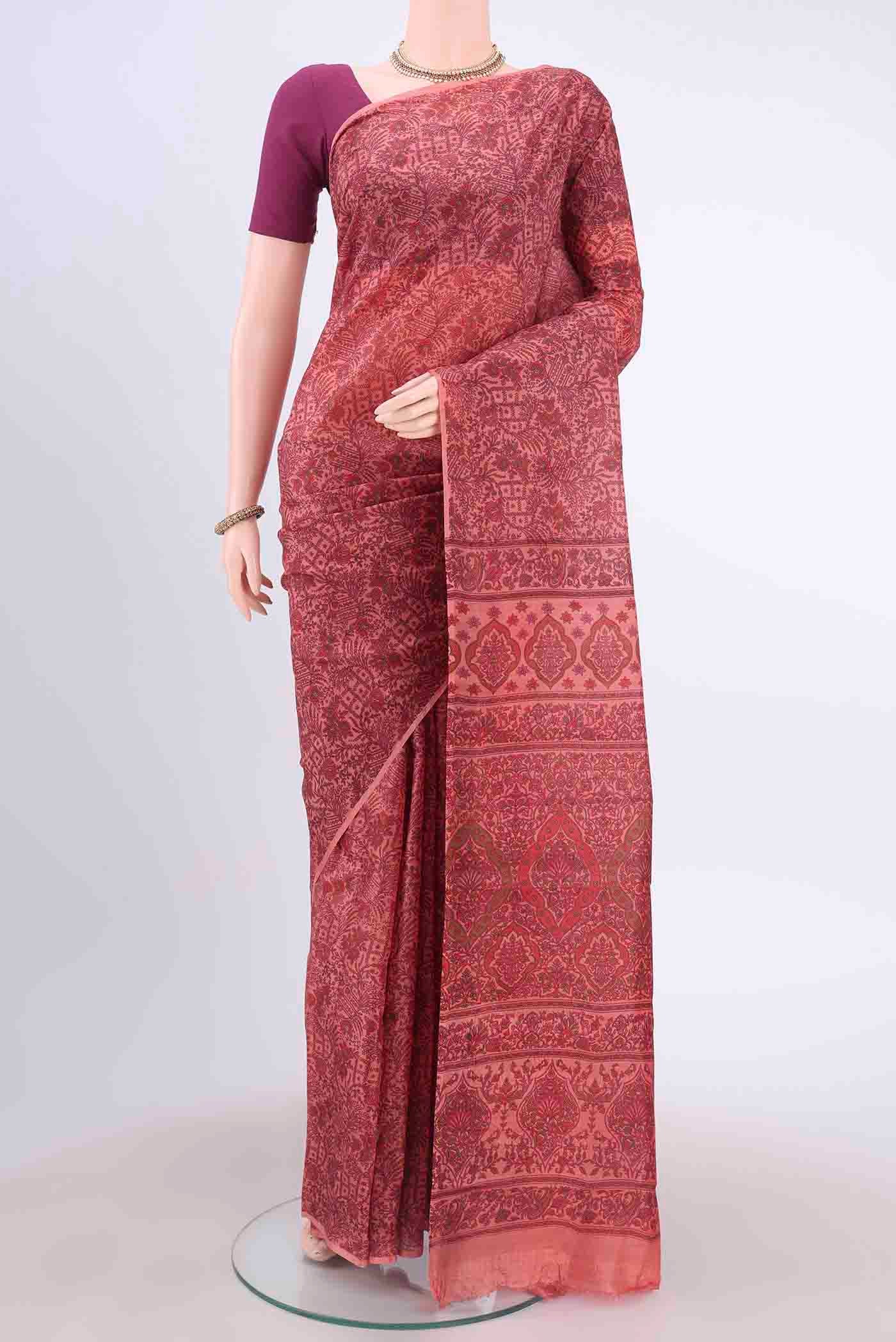 Peach Printed Silk Saree with Floral Print on the body and Without Border displayed on a mannequin