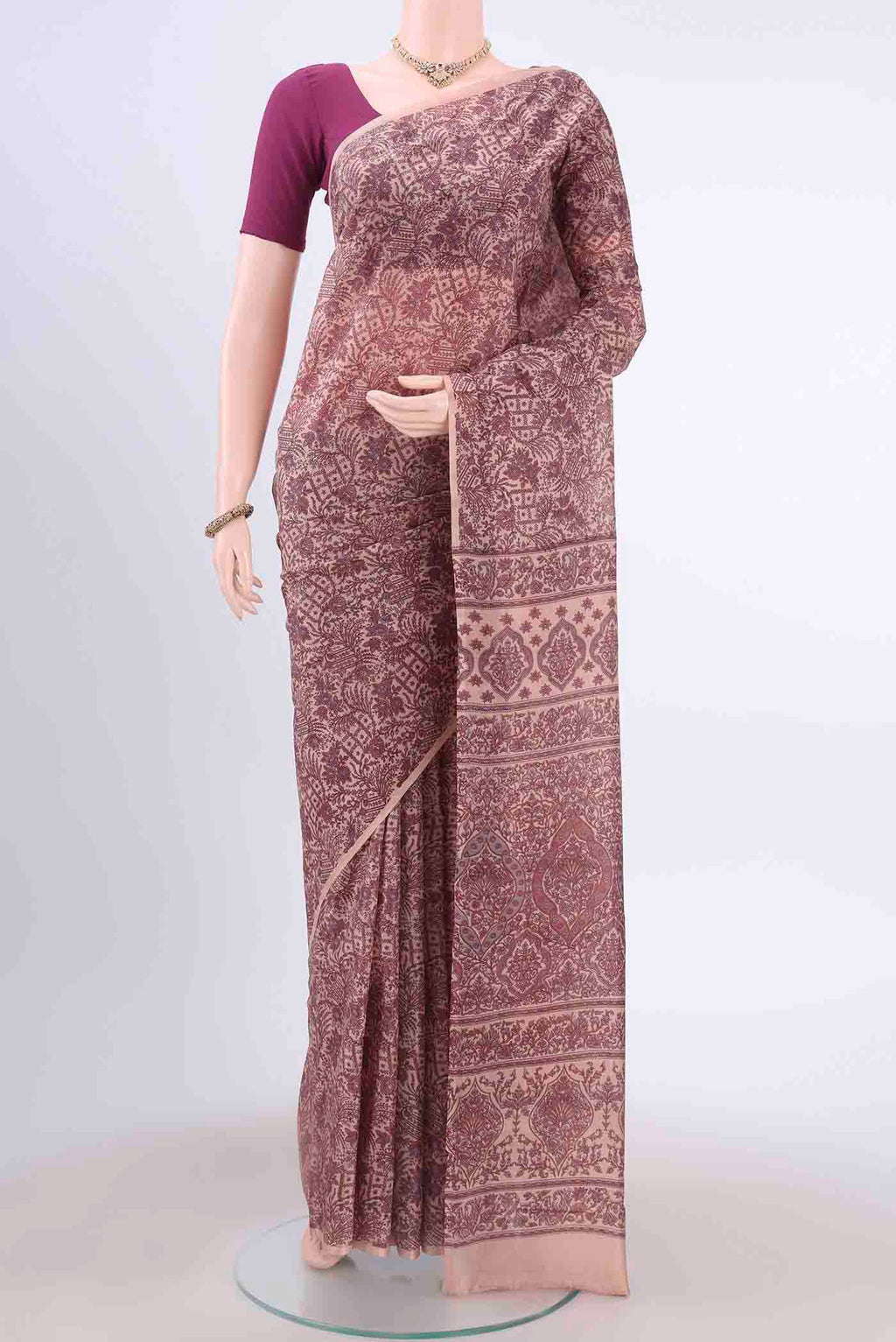 Peach Printed Silk Saree with Floral Print on the body and Plain Border displayed on a mannequin