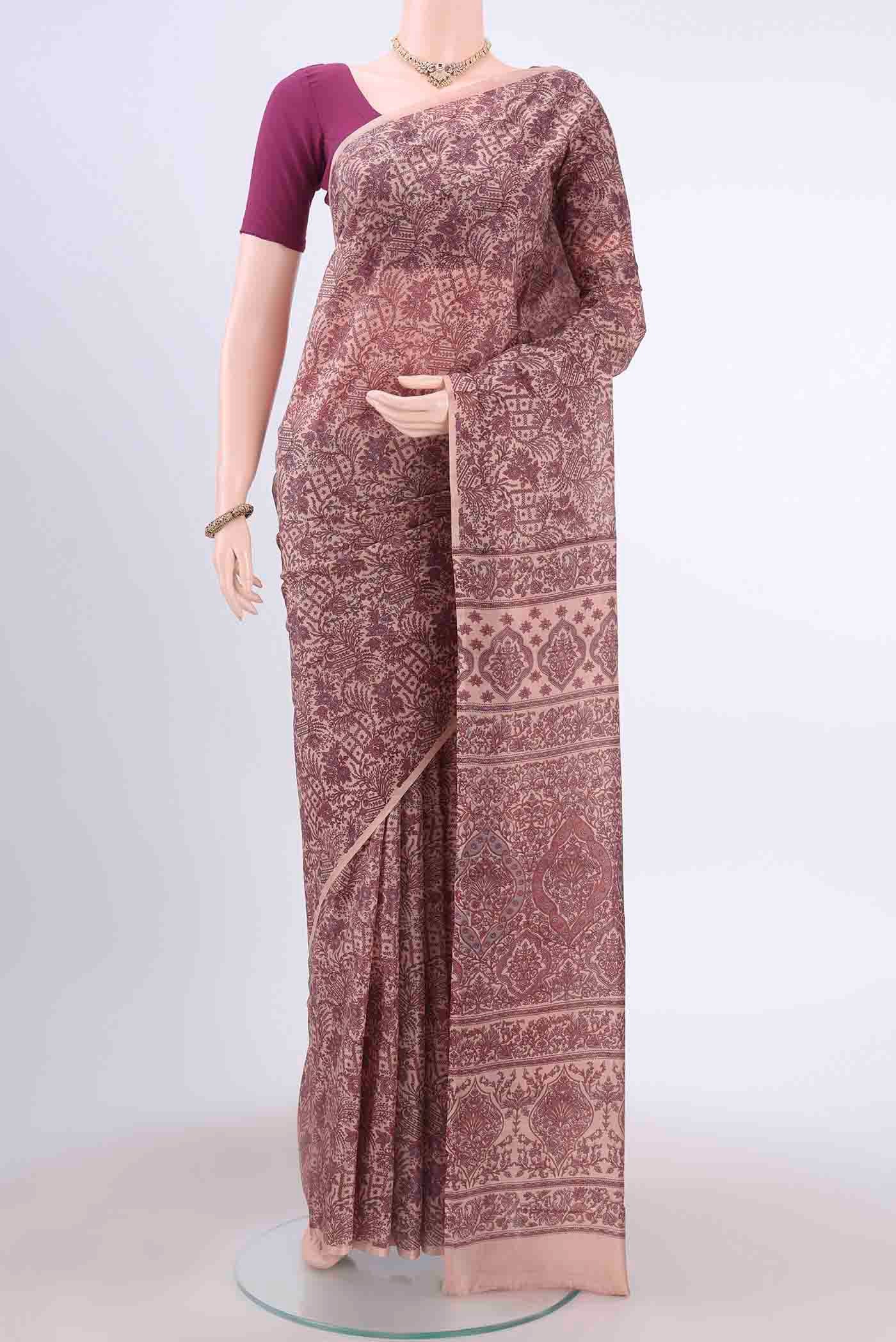 Peach Printed Silk Saree with Floral Print on the body and Plain Border displayed on a mannequin