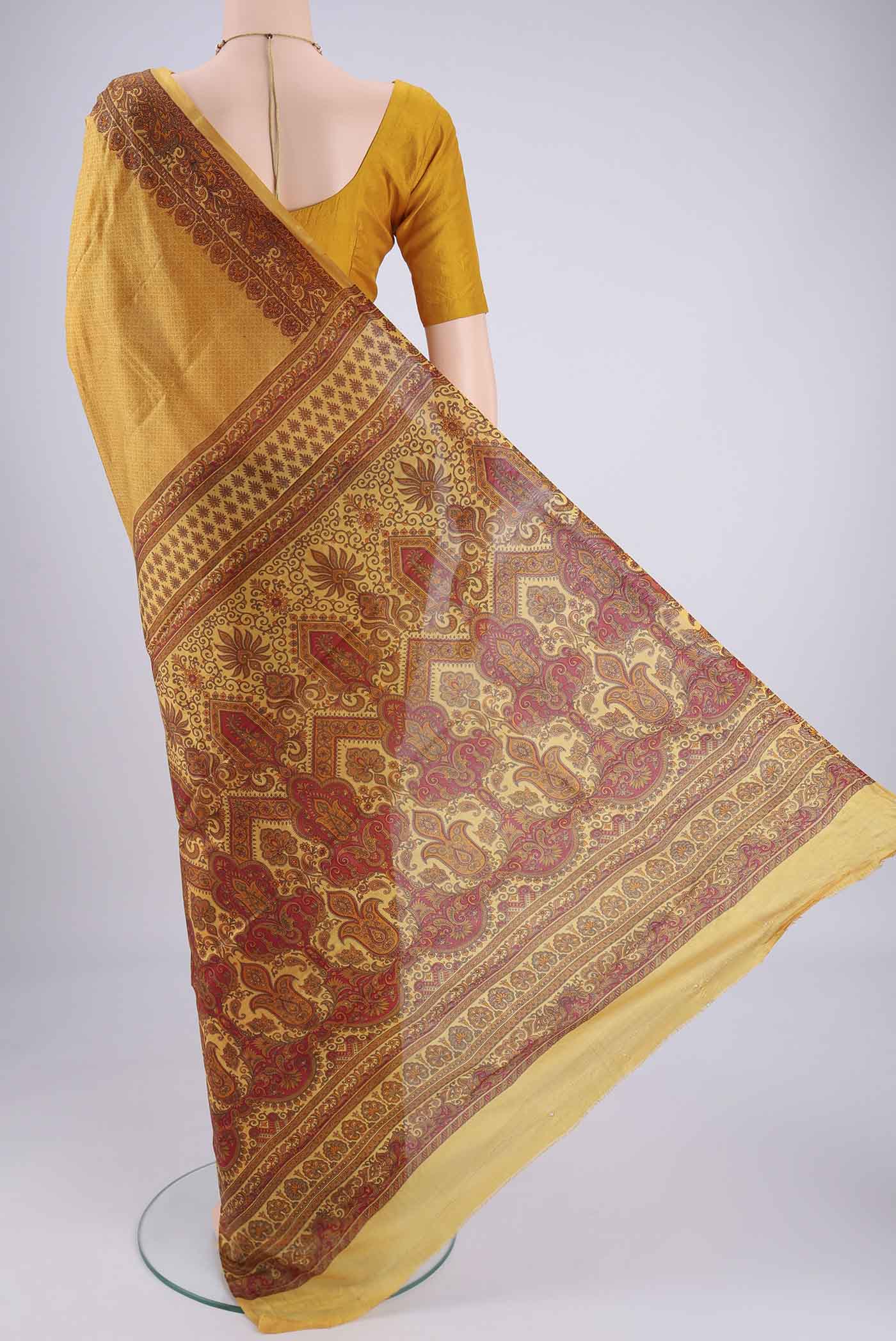 Flat view of Mustard Printed Silk Saree with Floral Print on the body and Printed Border. 