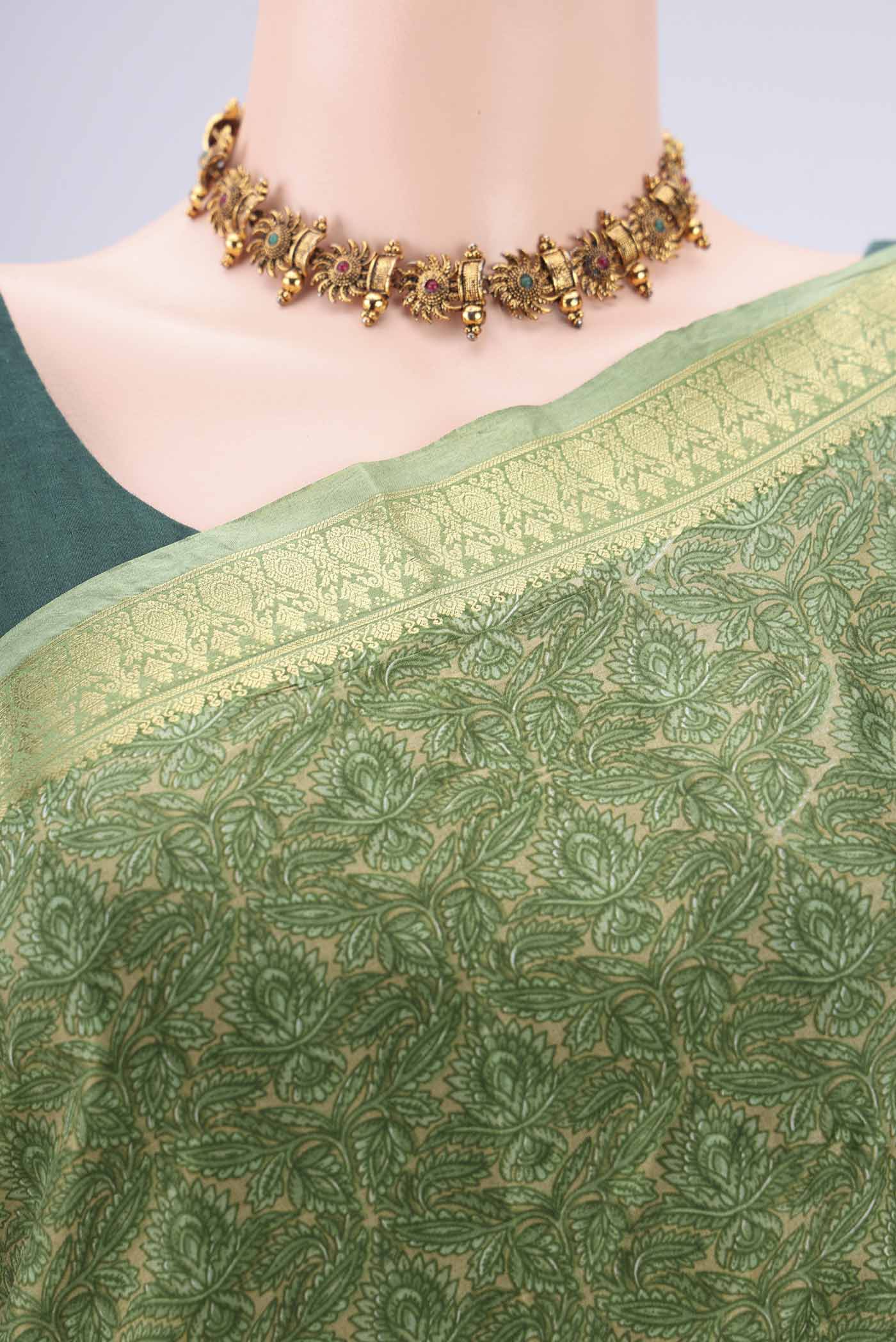 Border image of Light Green Printed Silk Saree with Printed design on the body and Zari Border. 