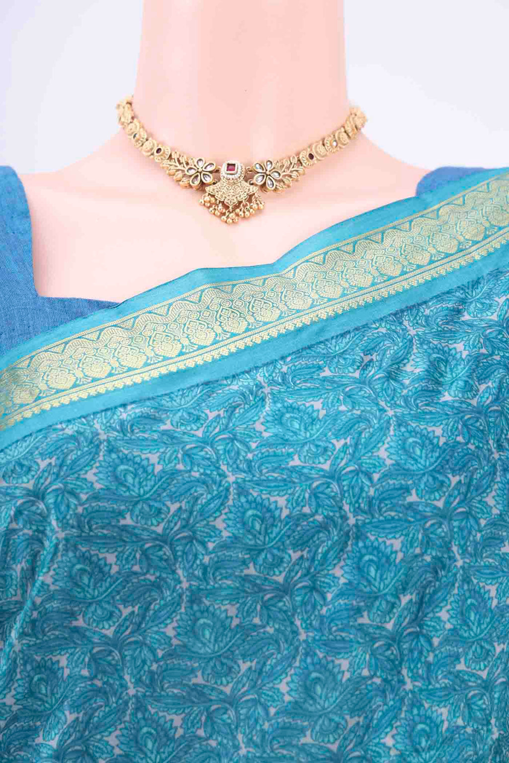 Border image of Blue Printed Silk Saree with Floral Print on the body and Zari Border