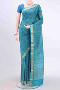 Blue Printed Silk Saree with Floral Print on the body and Zari Border displayed on a mannequin