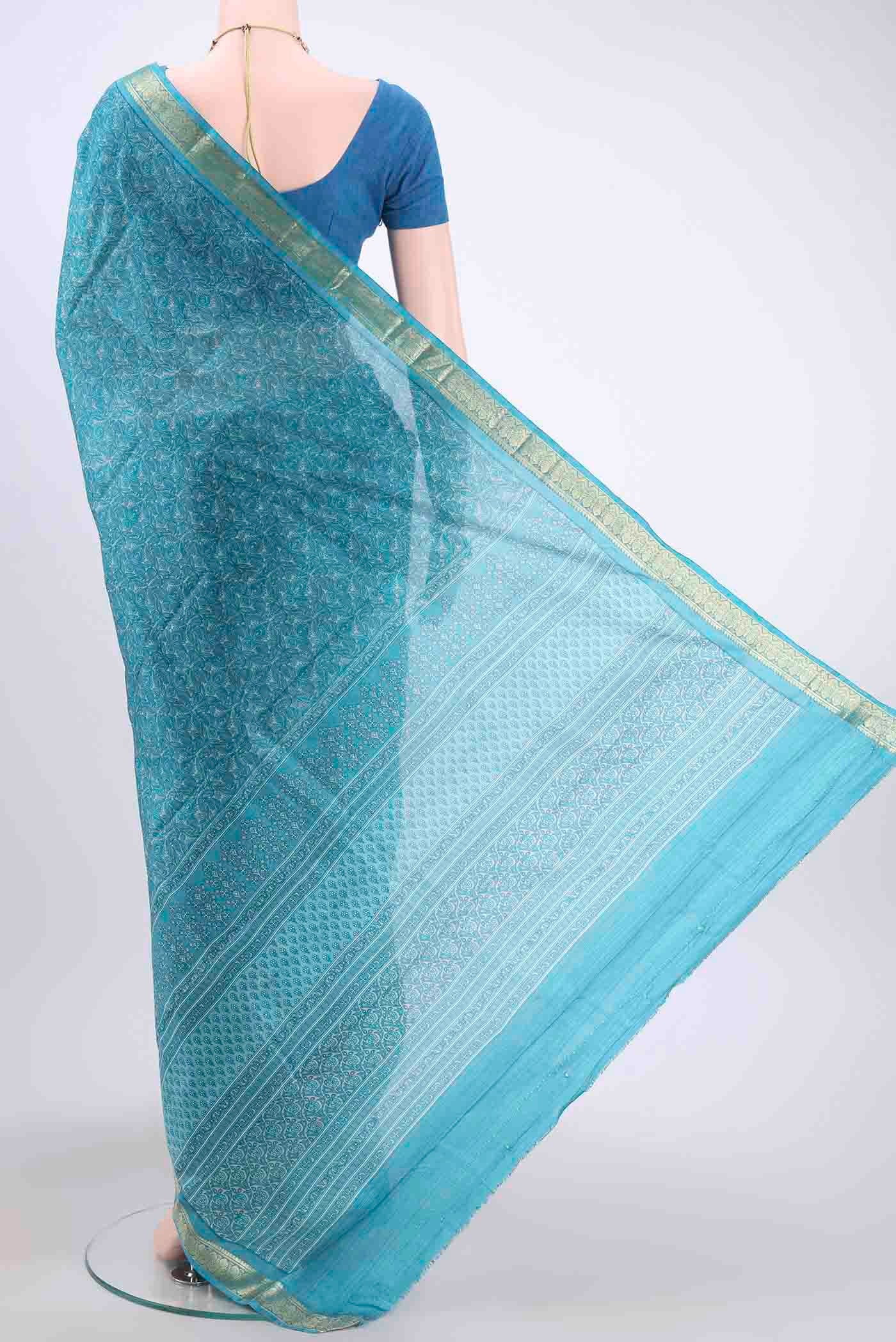 Flat view of Blue Printed Silk Saree with Floral Print on the body and Zari Border