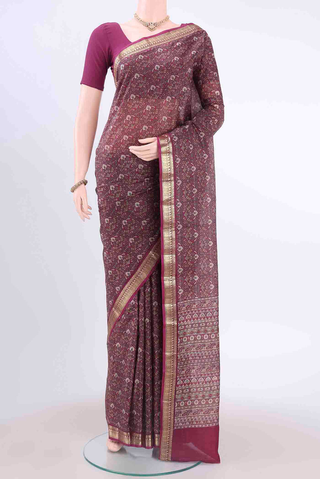 Magenta Printed Silk Saree with Floral Print on the body and Zari Border displayed on a mannequin