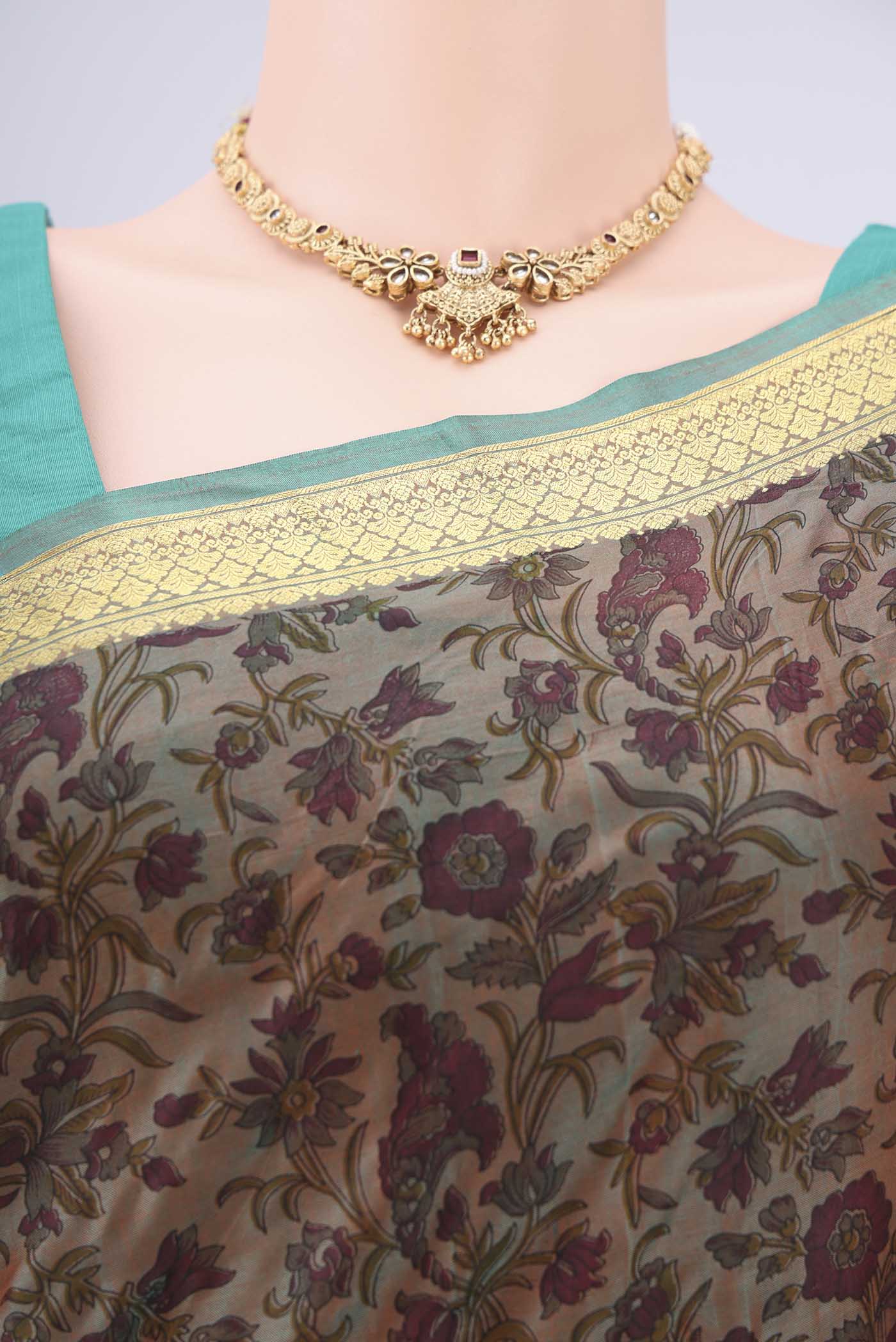 Border image of Pickle Green Dual Tone Printed Silk Saree with Printed design on the body and Zari Border. 