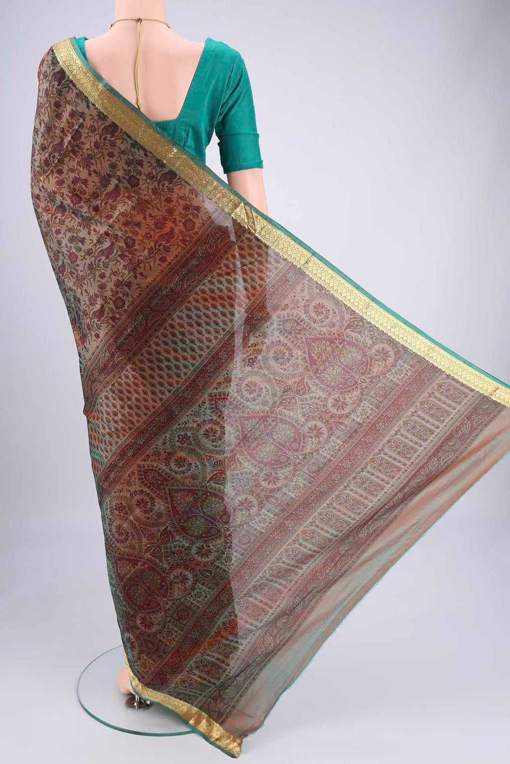 Flat view of Pickle Green Dual Tone Printed Silk Saree with Printed design on the body and Zari Border. 