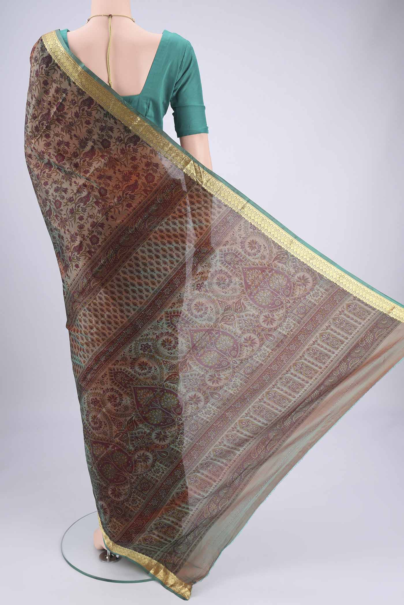 Flat view of Pickle Green Dual Tone Printed Silk Saree with Printed design on the body and Zari Border. 