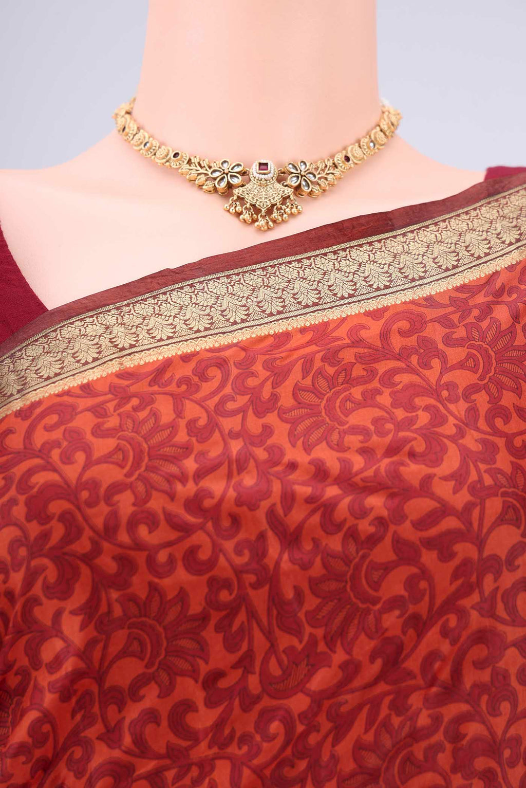 Border image of Rust Printed Silk Saree with Printed design on the body and Zari Border. 