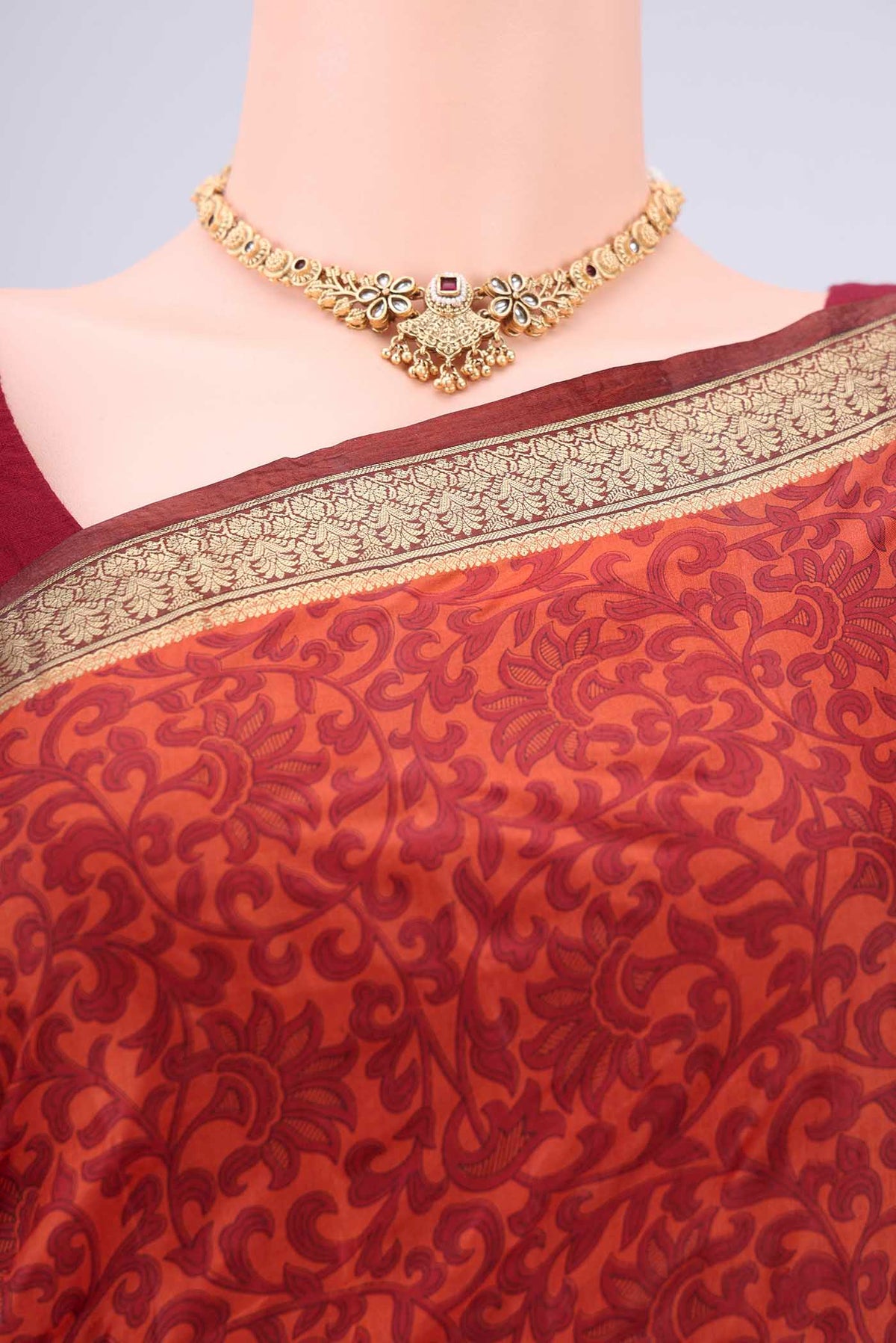 Border image of Rust Printed Silk Saree with Printed design on the body and Zari Border. 